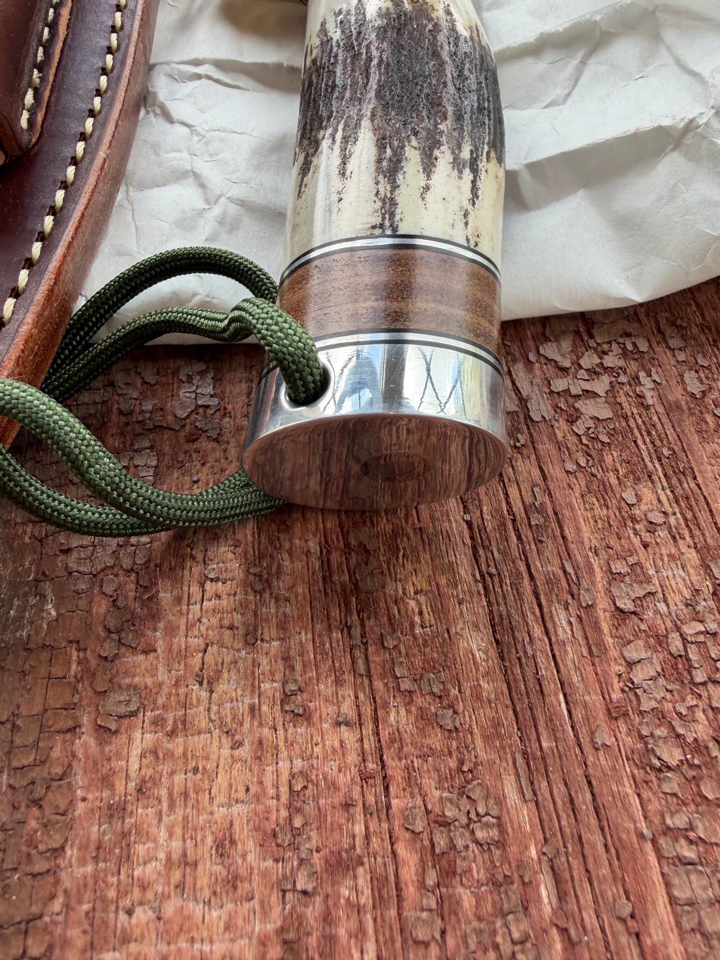 New in paper Randall Knife Model 25-6 Trapper in Stag Leather Handle Stainless Blade, nickel silver hilt , wrist thong.