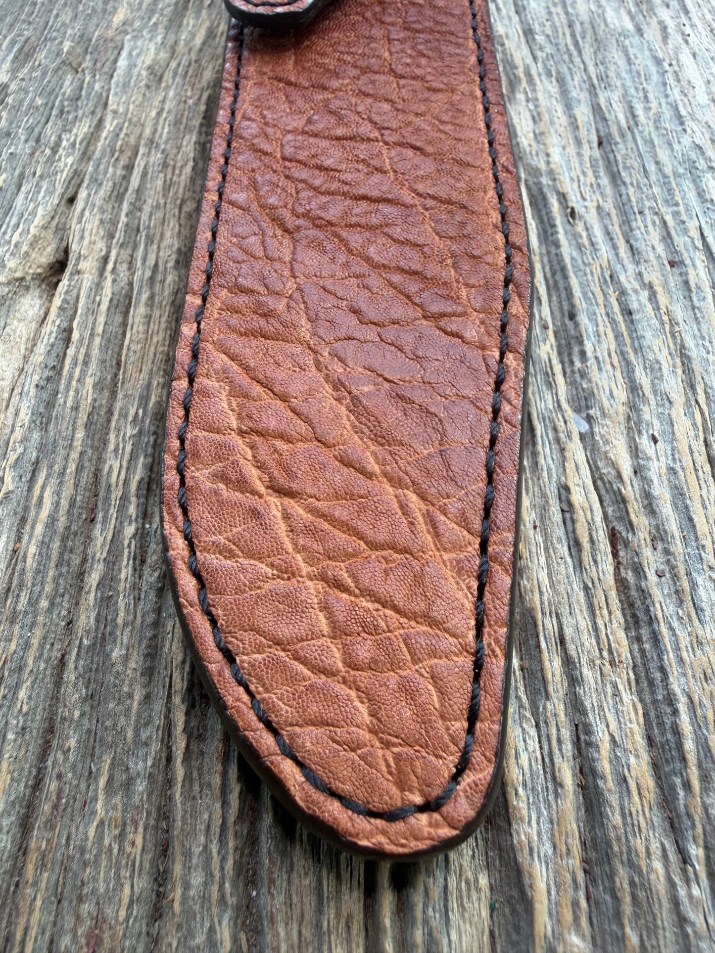 New Randall Model 1-7 Sheath in Exotic thick and textured Rust colored Elephant hide on brown leather from Treeman with a black Canteen snap. Hand tooled belt loop. Killer sheath.