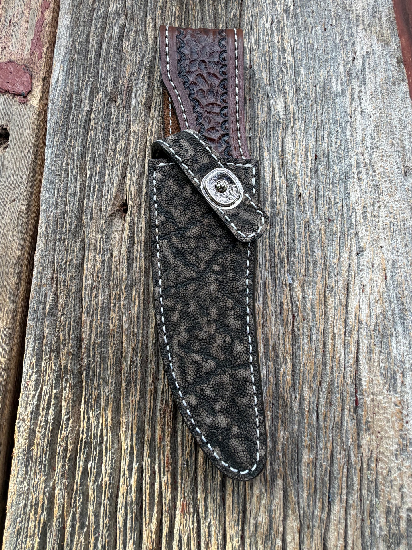 New Randall Model 27 Sheath in Exotic thick and textured Black and Grey Elephant Ear  on brown leather from Treeman with a silver Canteen snap. Hand tooled belt loop. Killer sheath.