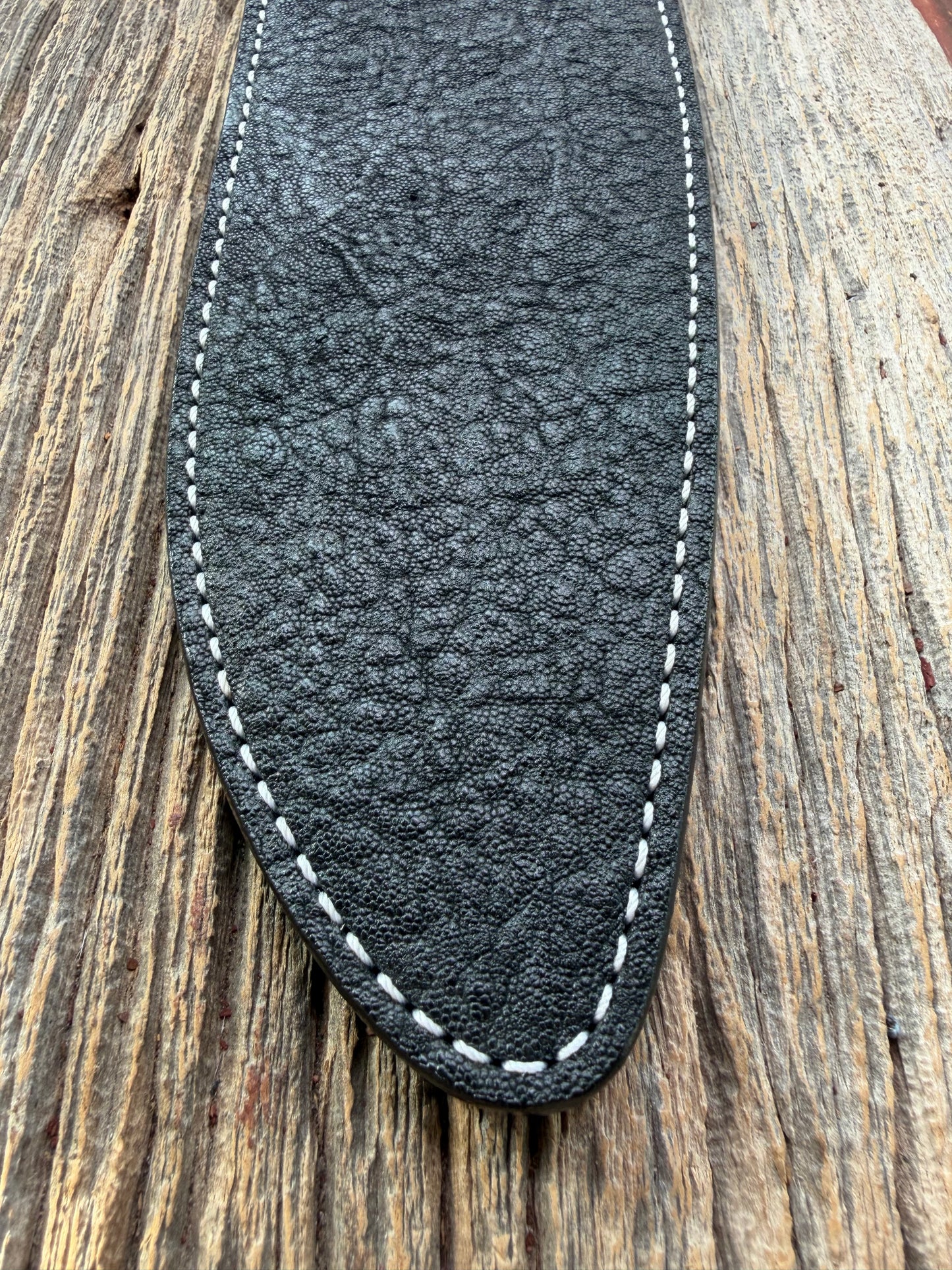 New Randall Model 12-11 Large Sasquatch Sheath in Exotic thick and textured Black Elephant hide on black leather from Treeman with a black Canteen snap. Hand tooled belt loop. Killer sheath.