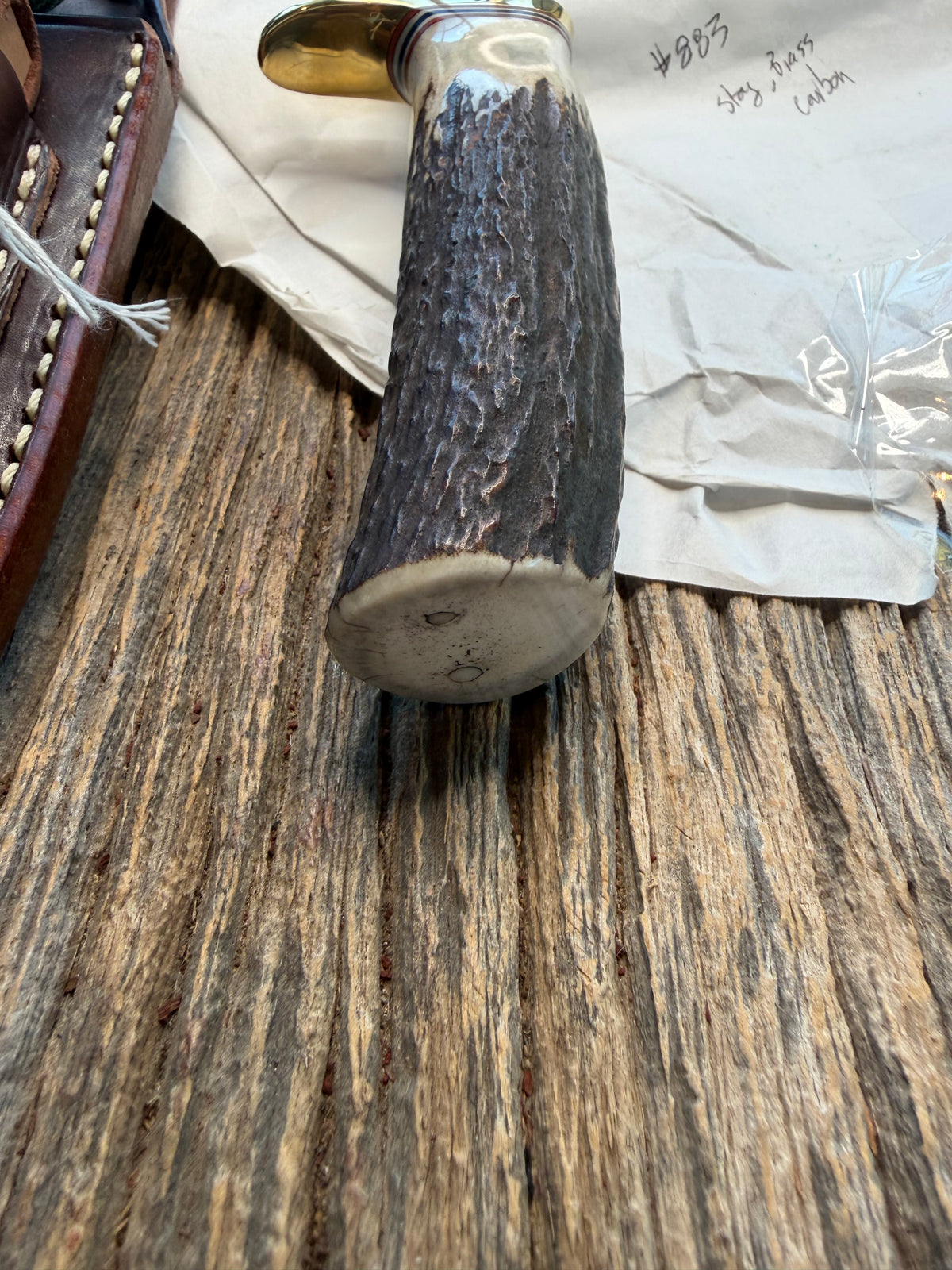 New in paper Randall Model 23 Game Master in Stag with a natural end. Carbon steel blade, Brass Single hilt and Brown leather sheath.
