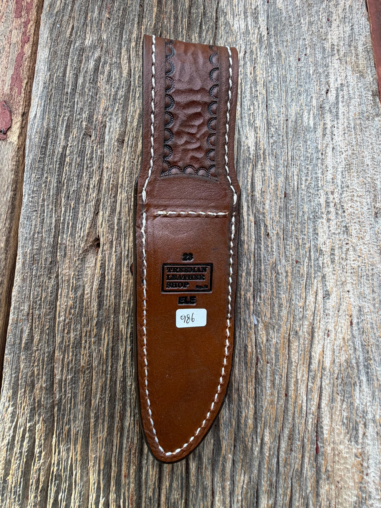 New Randall Model 23 Sheath in Exotic thick and textured Black and Grey Elephant Ear  on brown leather from Treeman with a silver Canteen snap. Hand tooled belt loop. Killer sheath.
