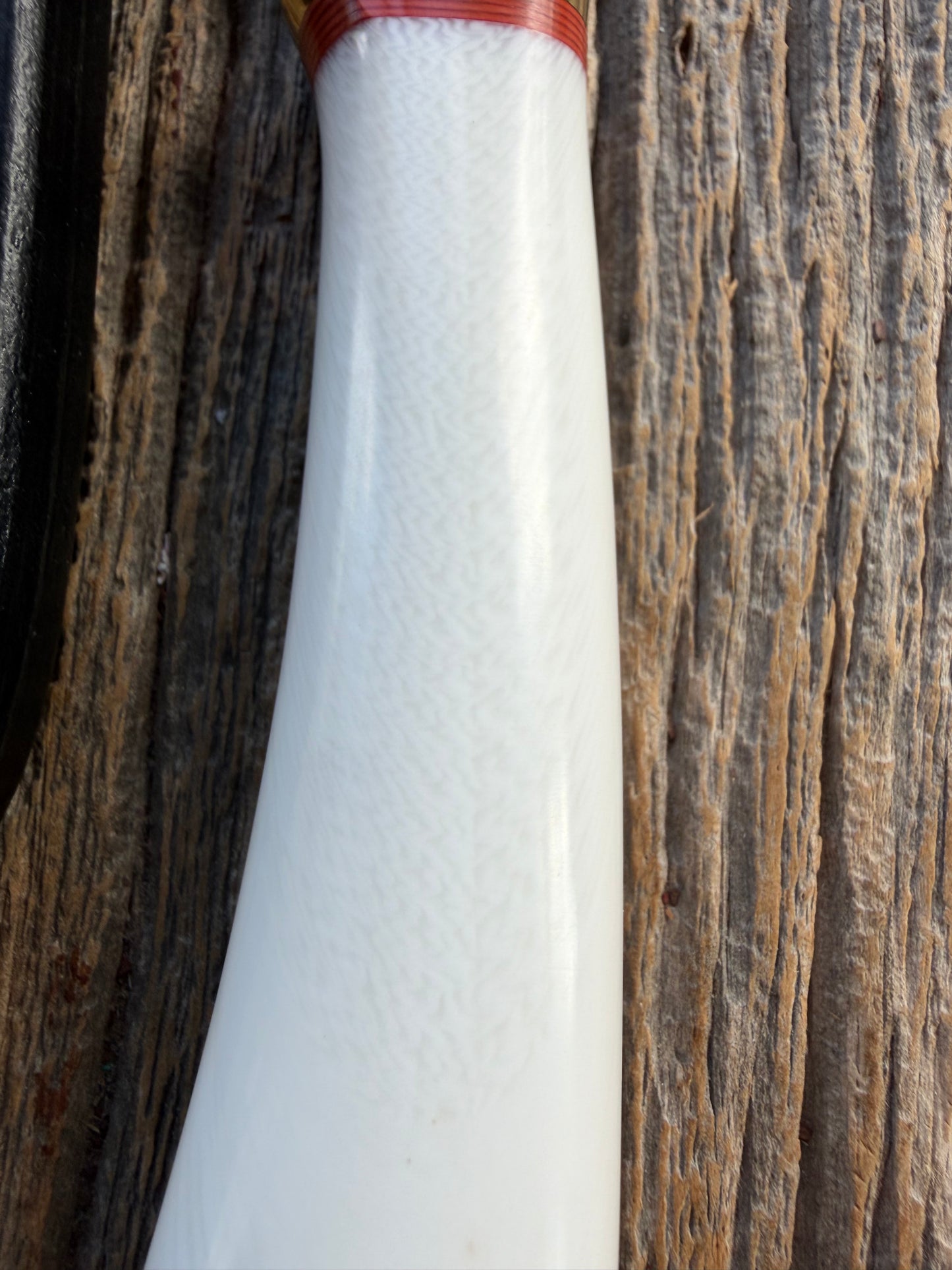 New in Paper Randall Non Catalog Model  Cattleman. White Ivorite handle. Red and silver spacers. Stainless blade.