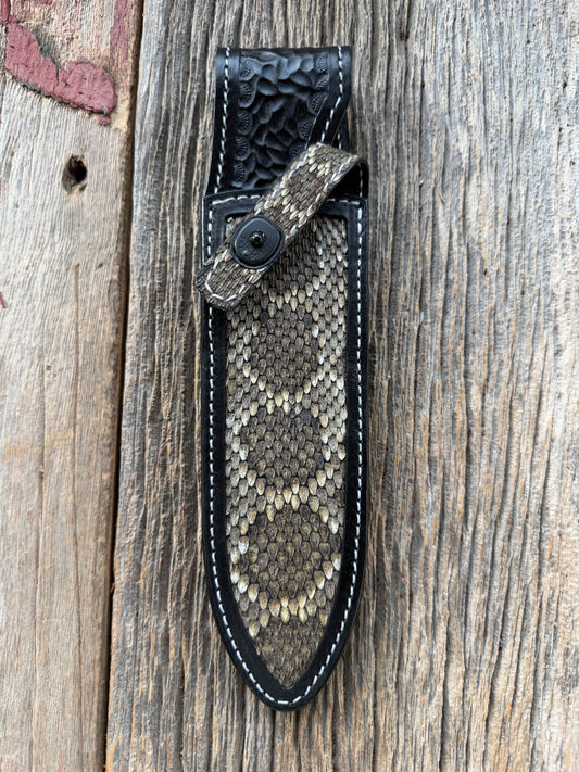 Randall Model Clinton Special sheath with inlayed Western Diamondback RattleSnake skin from Treeman Sheaths. Very dark skin on brown leather, white deviated stitching and black canteen snaps.