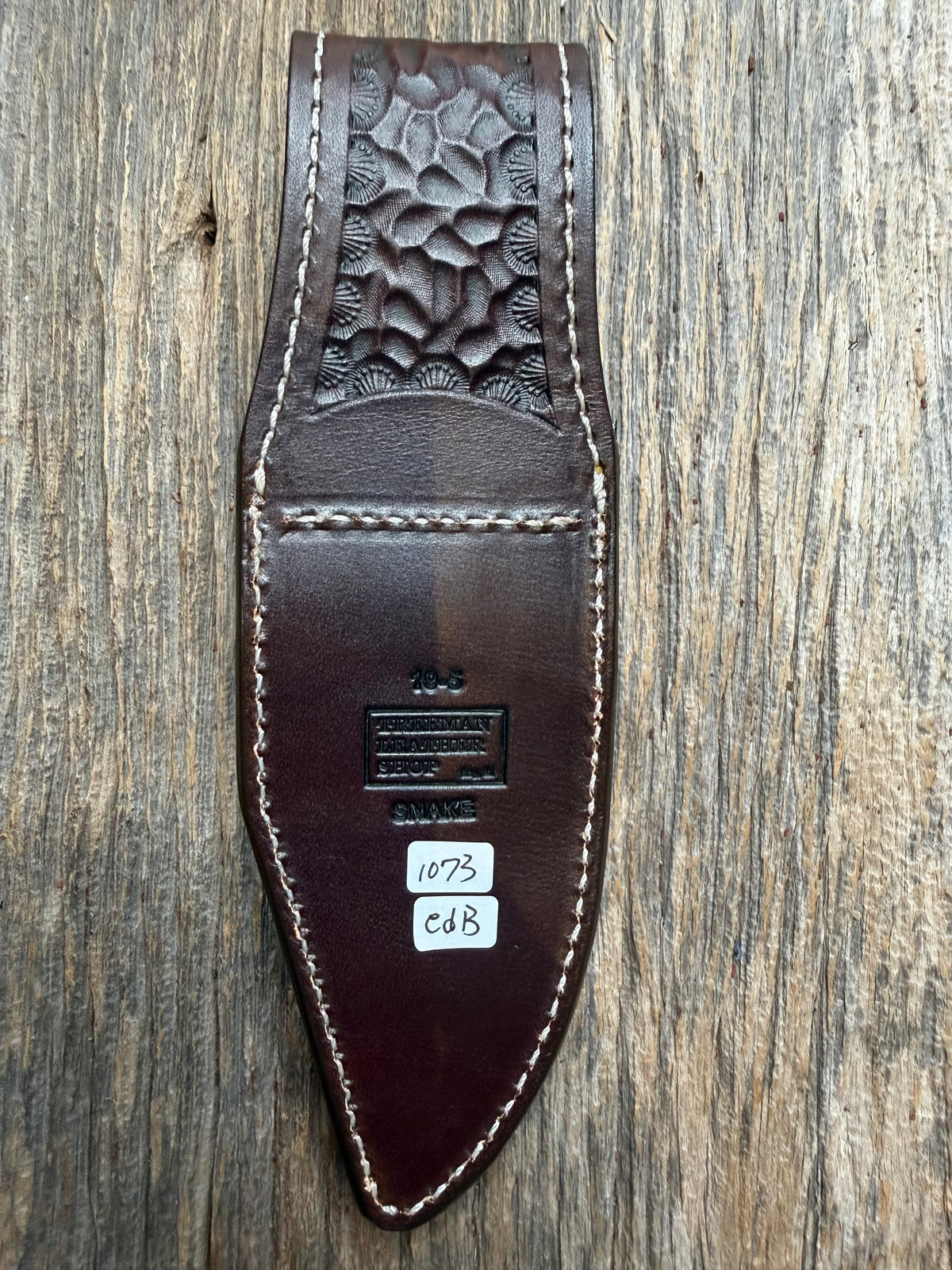 Randall Model 19-5 sheath with an Eastern Diamondback RattleSnake skin from Treeman Sheaths. Hand tooled belt loop, canteen snap. One the hardest skins to source.