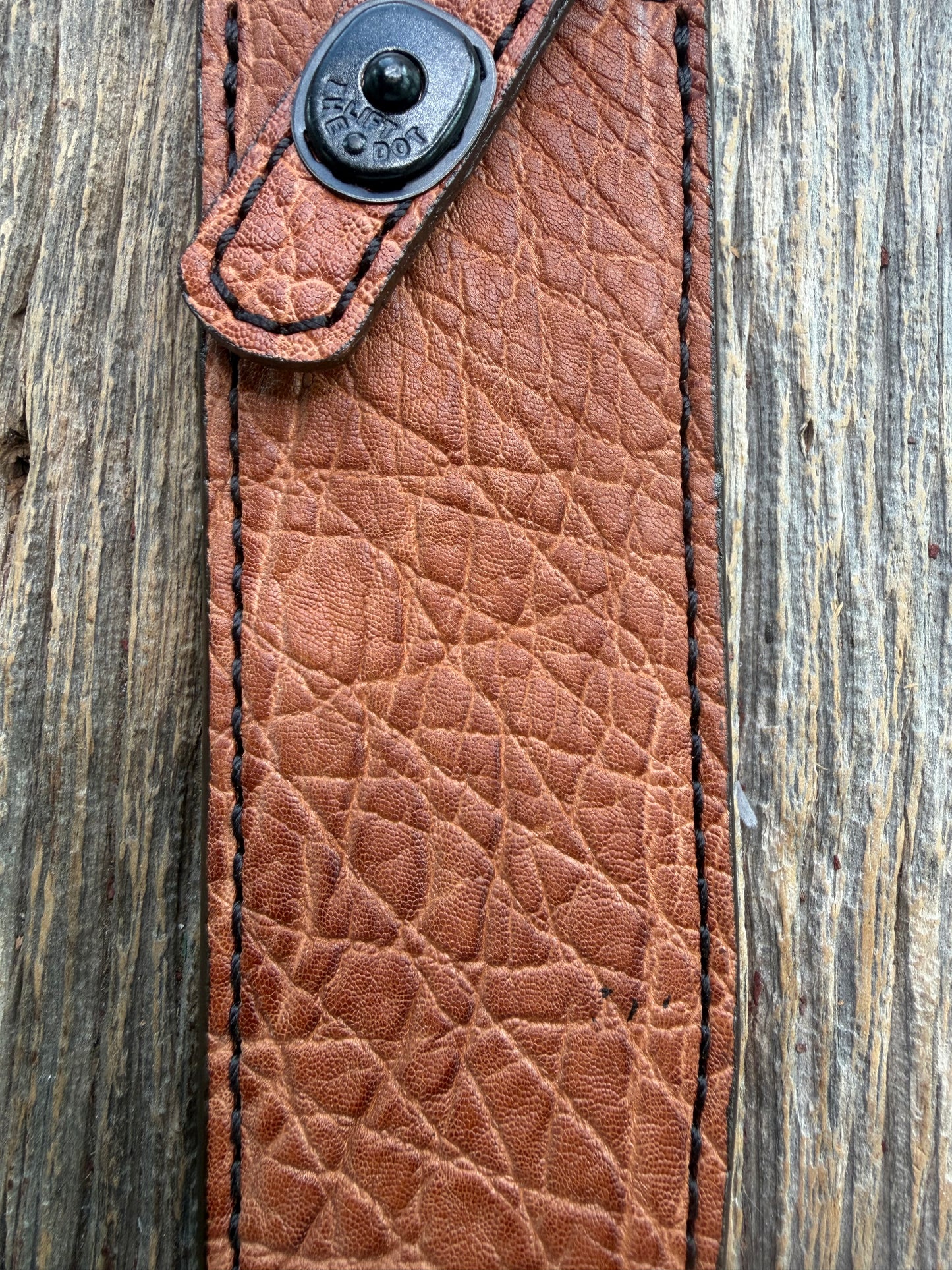 New Randall Model 1-8 Sheath in Exotic thick and textured Rust colored Elephant hide on brown leather from Treeman with a black Canteen snap. Hand tooled belt loop. Killer sheath.
