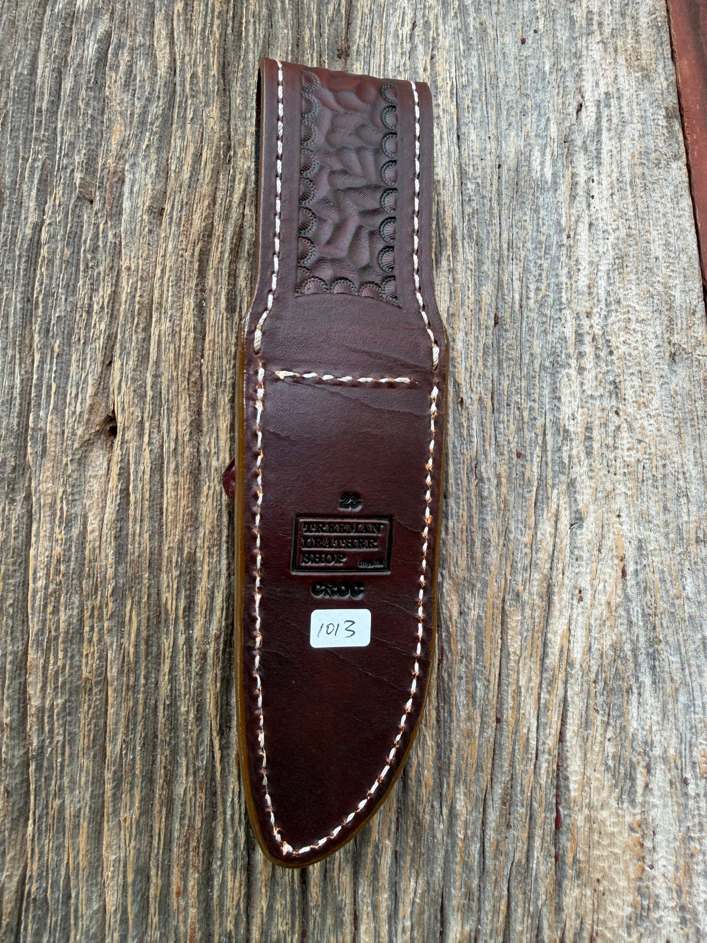 New Randall Model 23 Sheath in Exotic thick and textured Honey Crocodile skin on brown leather from Treeman with a silver Canteen snap. Hand tooled belt loop. Killer sheath.
