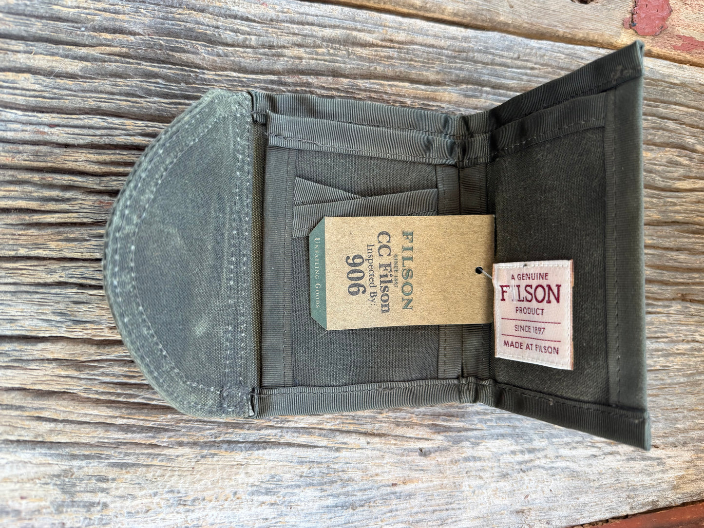 Adding to cart will not result in a sale. Personal Collection..Rare New with Tags Filson Oil Tin Cloth Tri Fold Wallet in Otter Green # 11069150 from February 2016.