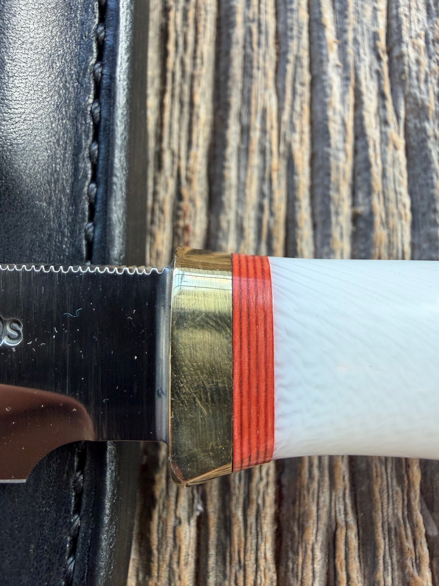 New in Paper Randall Non Catalog Model  Cattleman. White Ivorite handle. Red and silver spacers. Stainless blade.