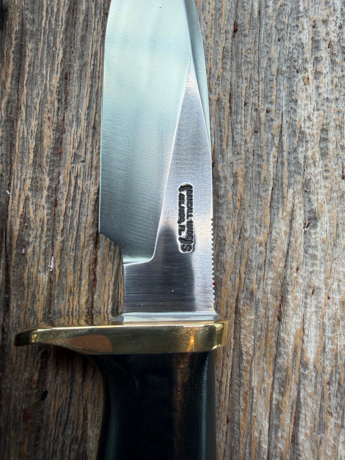 Nice Randall Model 28 Woodsman in Black Micarta. SS blade, brass single hilt. Lanyard hole. Black leather sheath.