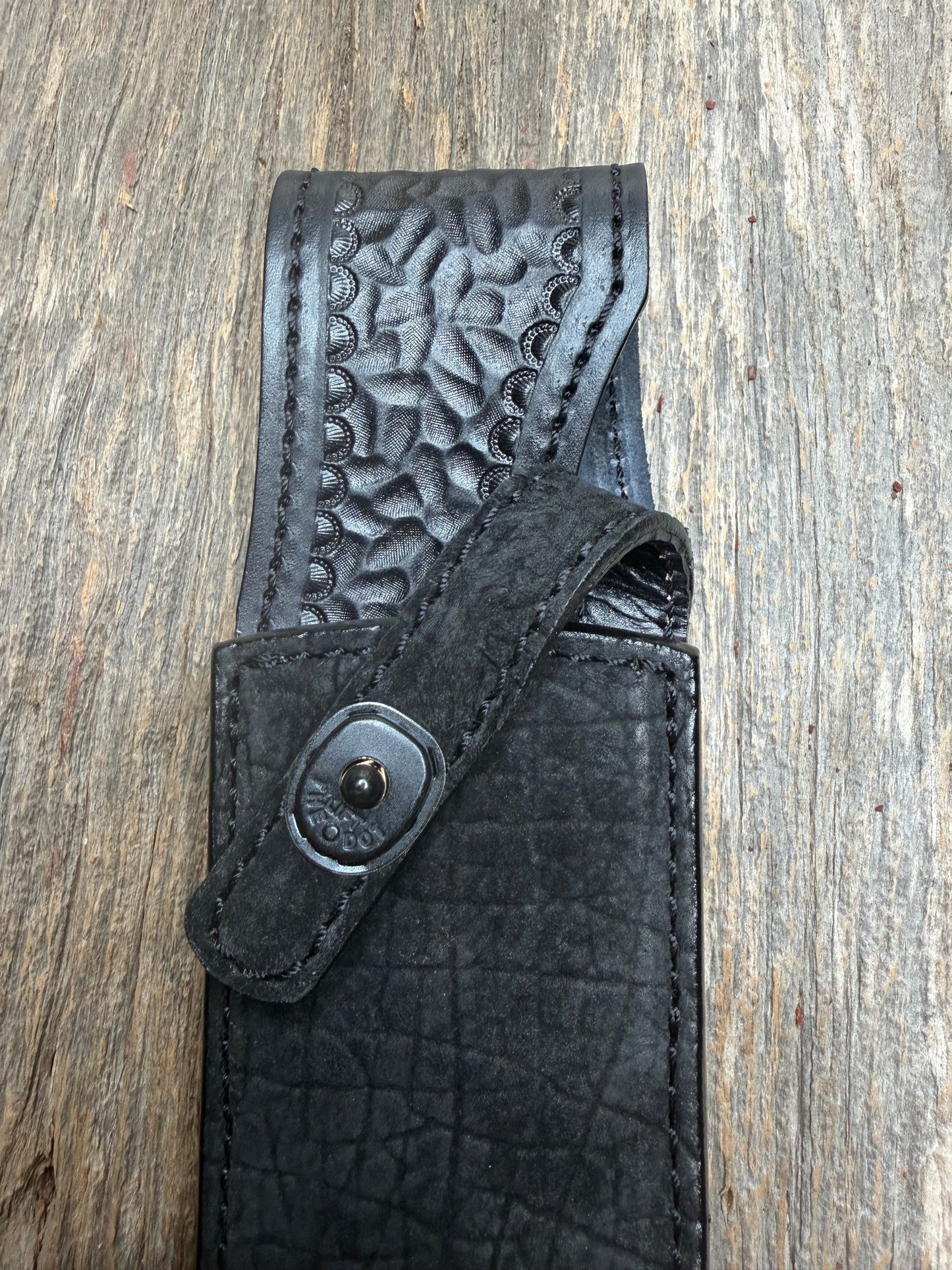 Randall Model 12-8 “Big Bear” in Black Hippo, forward curved hilt, black Canteen Snap, full brass stamping and stitching.