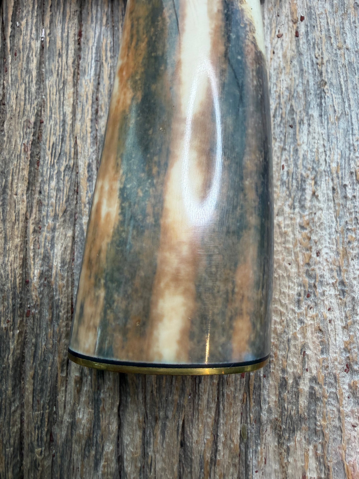 Randall Model 12-11 Smithsonian “Smitty” in a Huge piece of Green, Brown and Blue Fossil Walrus Ivory. Brass Hilt and Brass Butt plate fully engraved in Silver from Jere Davidson.  Stunning piece.