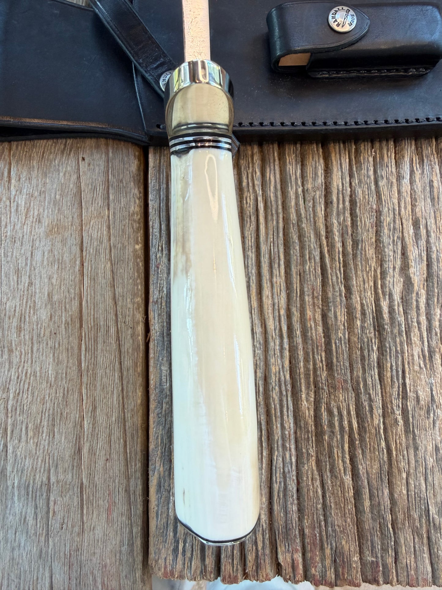 New in Paper Randall Model 12-11 Dealer Special Large Sasquatch Huge piece of Pearly White Fossil walrus Ivory, Finger Groves , # 1134 Nickel Silver Hilt and butt cap.