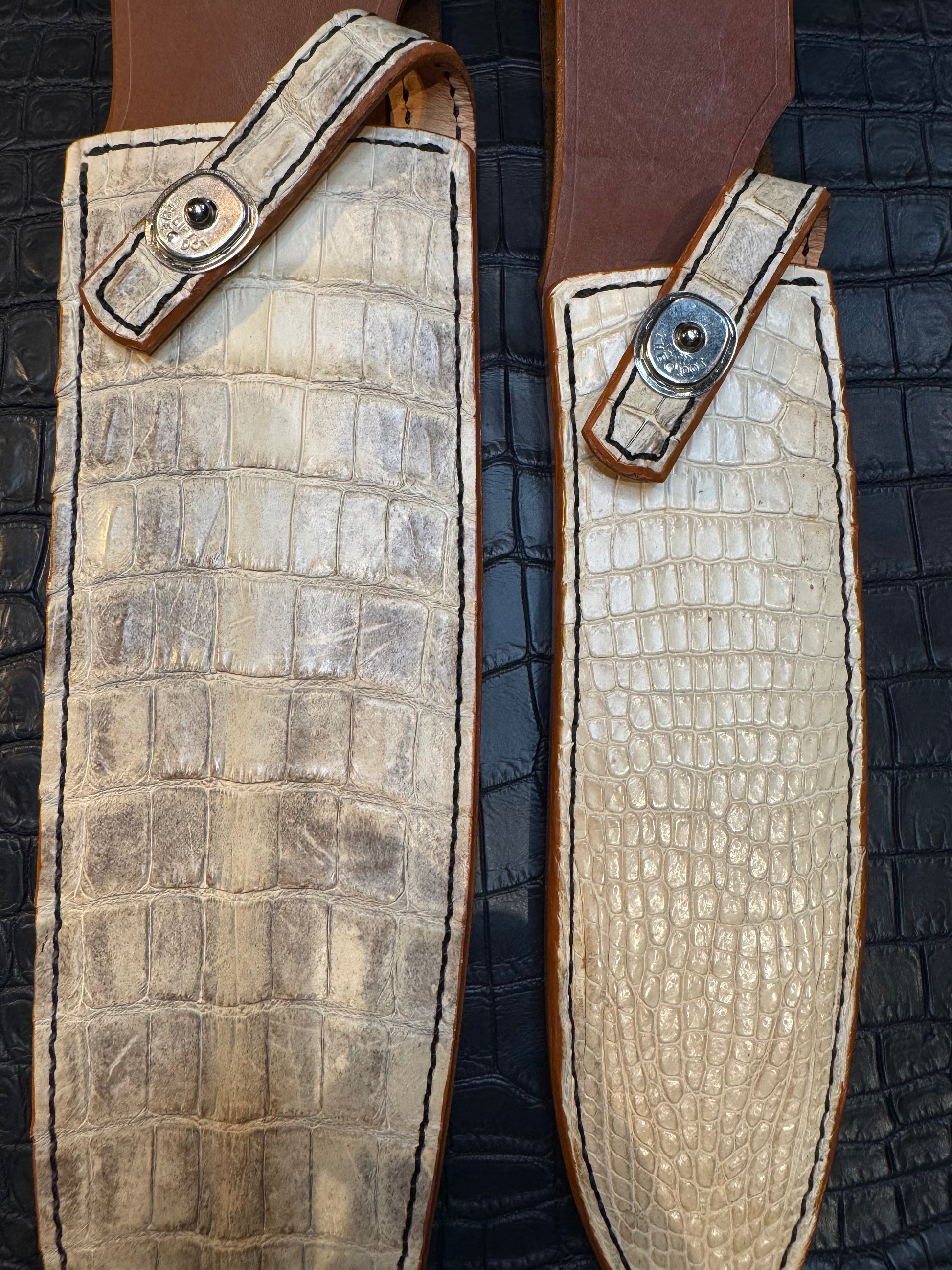A pair of Randall Model 12-11 Large Sasquatch and Randall Model 12-8 Small Sasquatch Sheaths in Exotic Ivory Crocodile by Treeman.