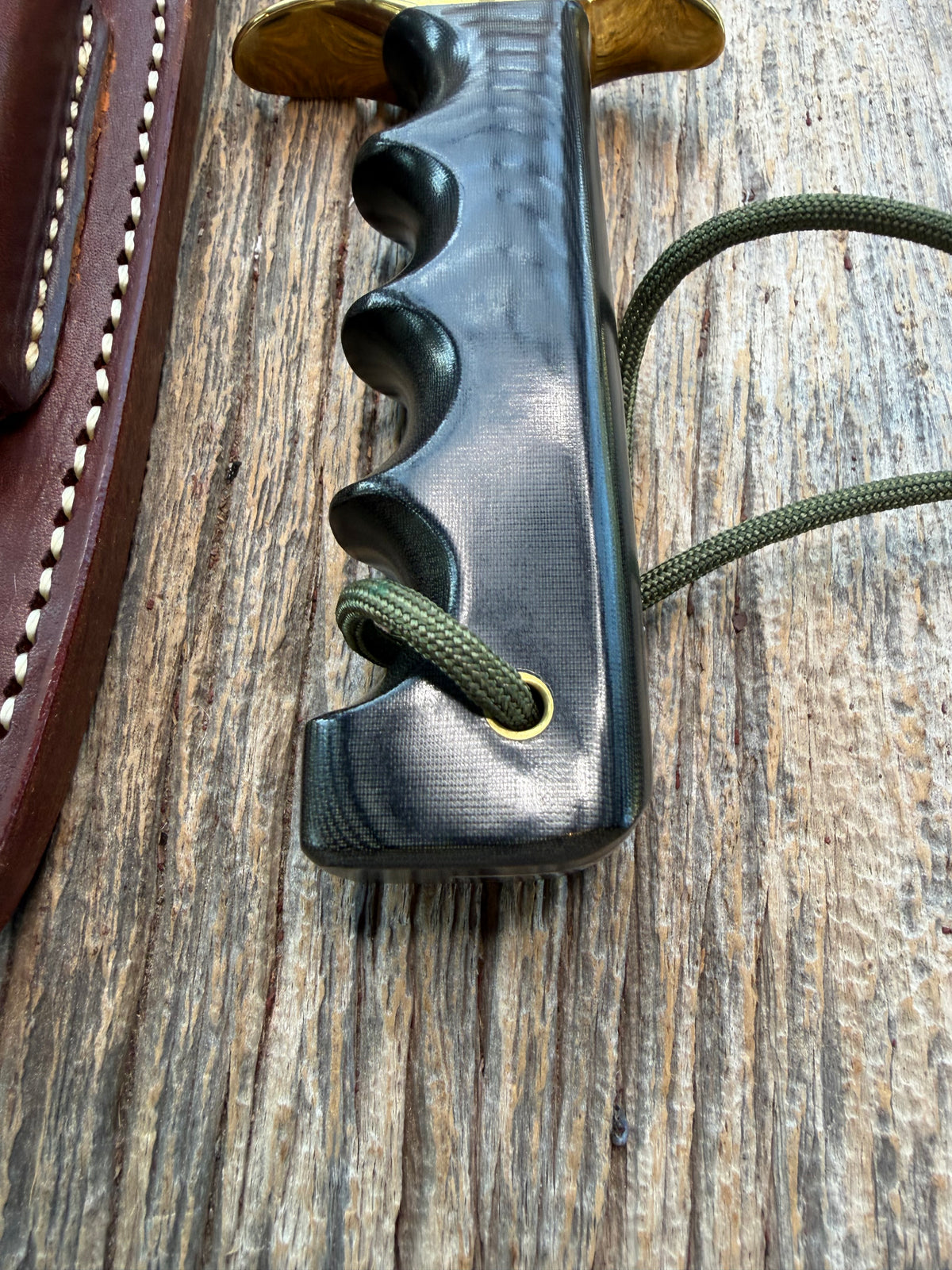 New in paper Randall Model 16 SP#1 Special fighter with a Black Micarta handle. SS blade, brass hilt. Lanyard. Brown leather sheath.