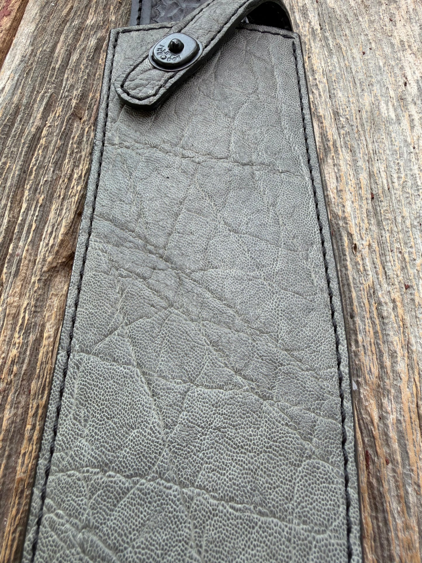 New Randall Model 12-11 Large Sasquatch Sheath in Exotic thick and textured Grey Elephant Hide on black leather from Treeman with a black Canteen snap. Hand tooled belt loop. Killer sheath.