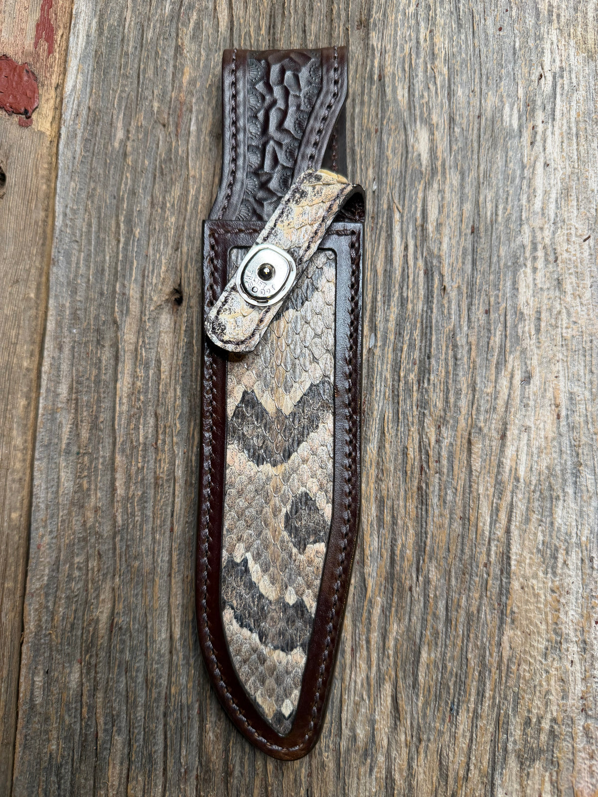 Randall Model 1-7 sheath with a Canebrake RattleSnake skin from Treeman Sheaths. Vibrant colors and along side Copperheads the hardest skin to source.