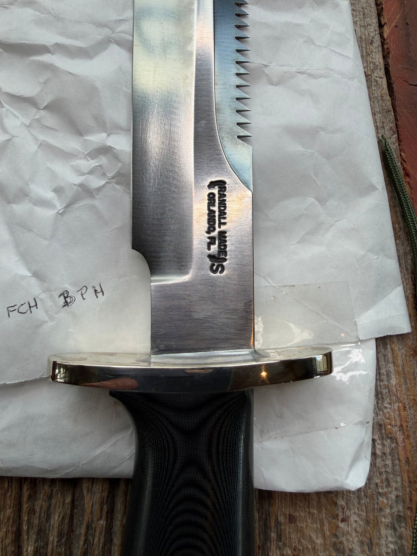 New in Paper Randall Model 14-7.5 in Black Micarta handle, Nickel Silver Hilt, Stainless steel, Sawteeth and Lanyard.