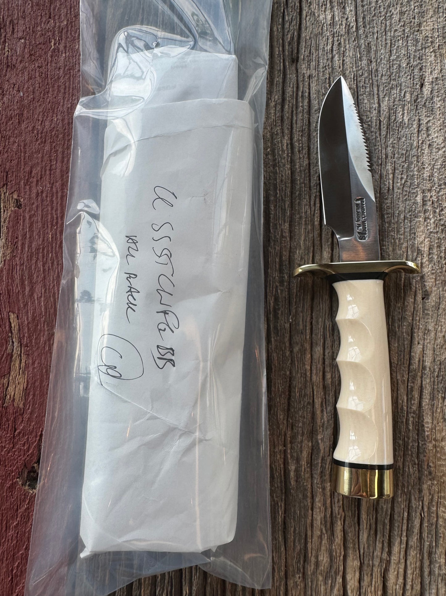 New in paper Randall Model Combat Companion with a nice piece of customer supplied Warthers Resin with finger grooves. Teeth, Stainless Steel, Brass Hilt and brass butt cap.