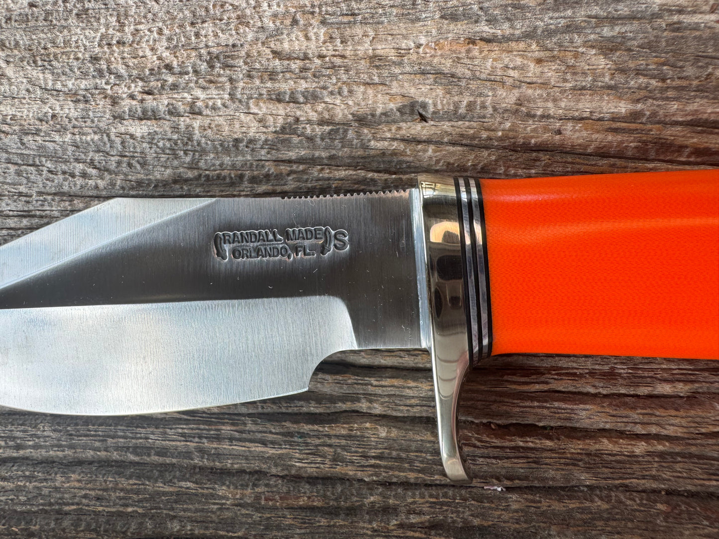 New in paper Randall Model 19-5 with a nice piece of customer supplied Orange G10. Stainless Steel, Nickel Silver Hilt and Butt cap.