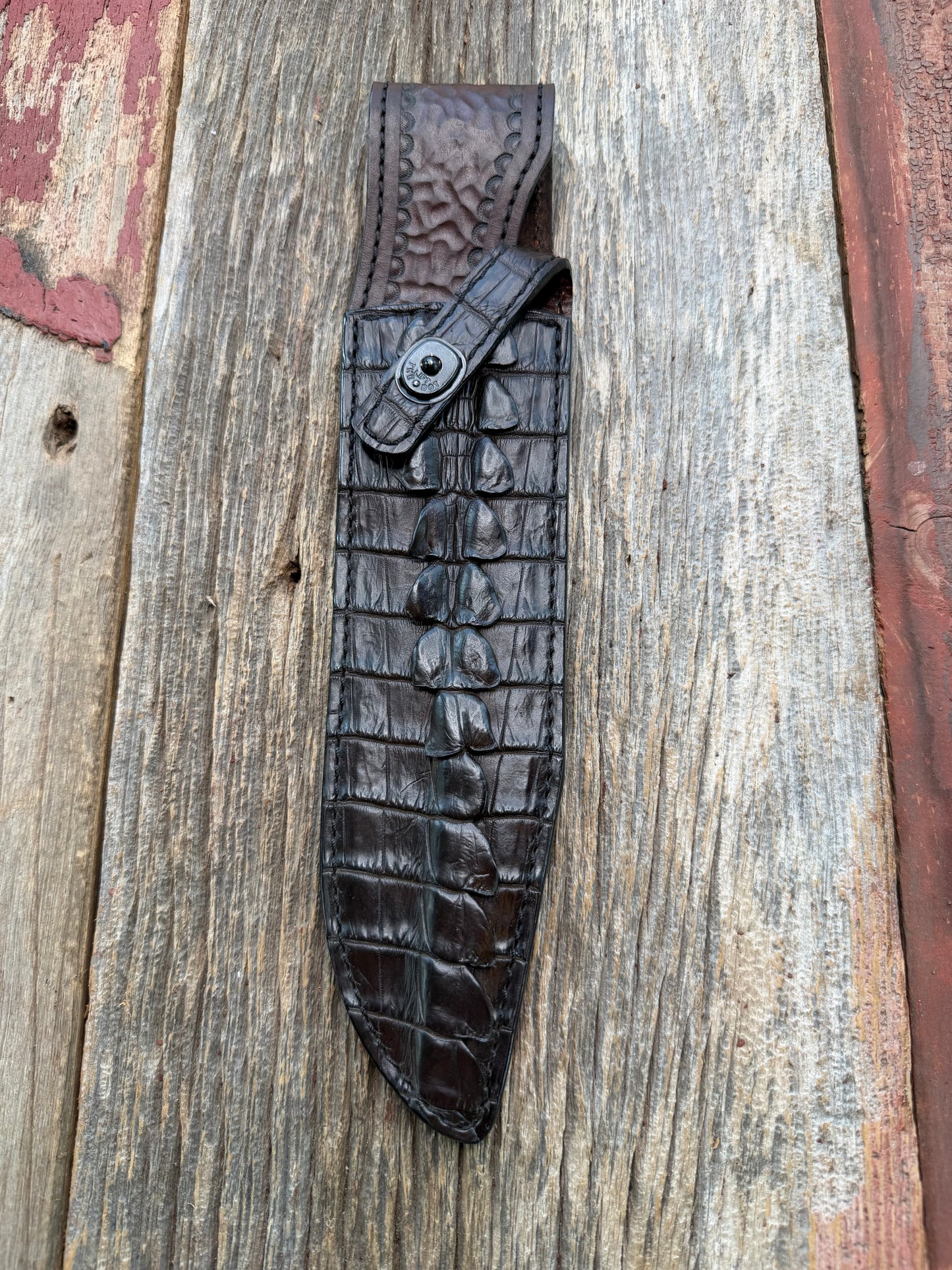 New Randall Model 12-9 Sheath in Exotic Dark Brown Matte Crocodile Tail from Treeman with the newest Black Canteen snap. Killer sheath.