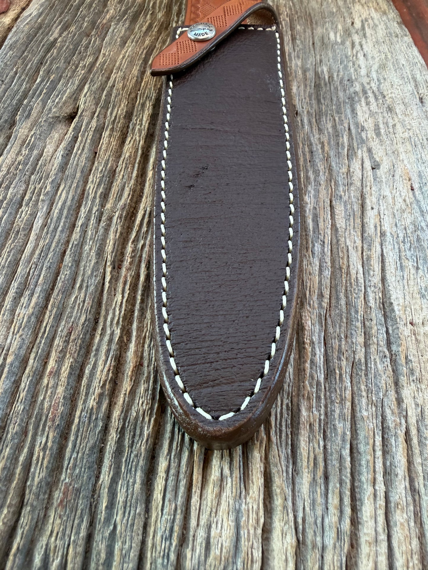 New Randall Model 2-7 Sheath in Exotic Brown Cape Buffalo with full leather hand tooled belt loop. Randall snap and stamp on the back. Custom Made at Sullivan’s by Gutcher