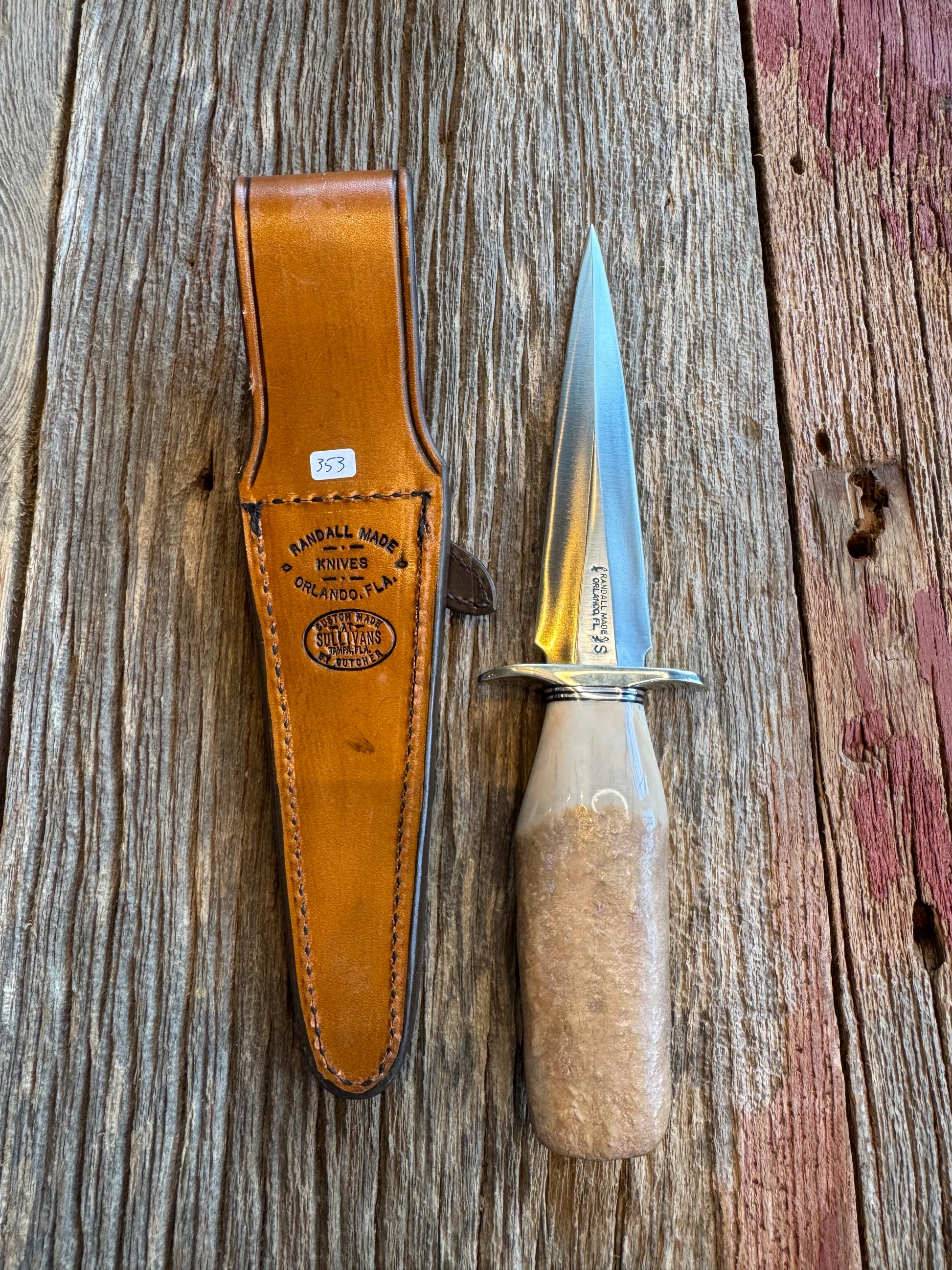 Randall Knife Model 13-6 Small Arkansas Toothpick Artifact. Fossil Walrus in an Ice Ax Handle. Included is a very rare Gutcher Rattlesnake sheath, Stainless Steel.