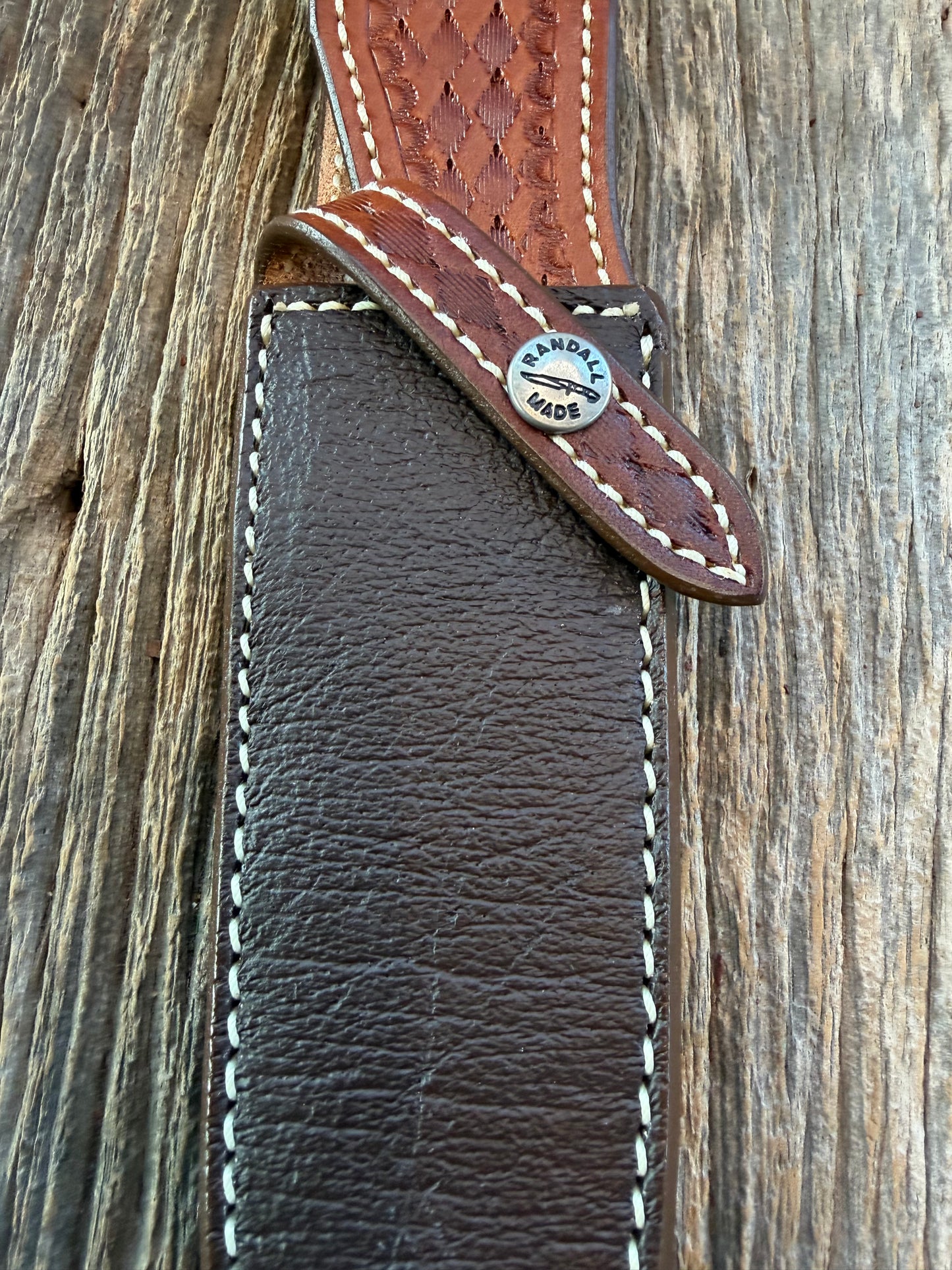 New Randall Model 25-6 Sheath in Exotic Brown Cape Buffalo with full leather hand tooled belt loop. Randall snap and stamp on the back. Custom Made at Sullivan’s by Gutcher