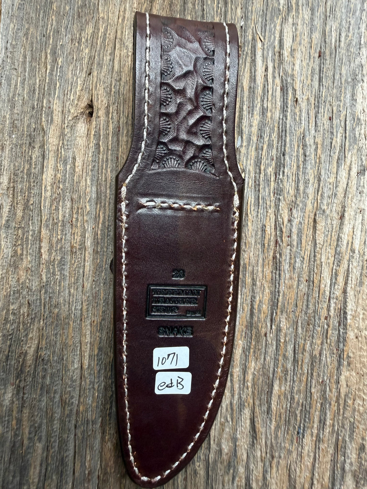 Randall Model 28 sheath with an Eastern Diamondback RattleSnake skin from Treeman Sheaths. Hand tooled belt loop, canteen snap. Vibrant colors and one of the hardest skins to source.