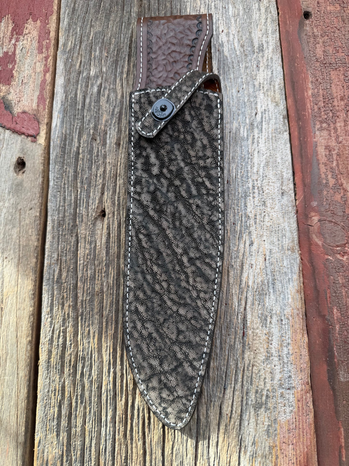New Randall Model 12-11 Large Sasquatch Sheath in Exotic thick and textured Black and Grey Elephant Ear  on brown leather from Treeman with a black Canteen snap. Hand tooled belt loop. Killer sheath.