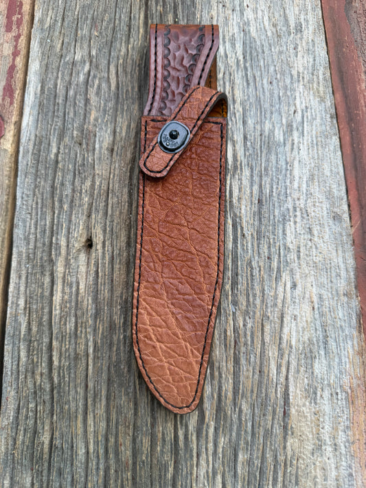 New Randall Model 1-7 Sheath in Exotic thick and textured Rust colored Elephant hide on brown leather from Treeman with a black Canteen snap. Hand tooled belt loop. Killer sheath.