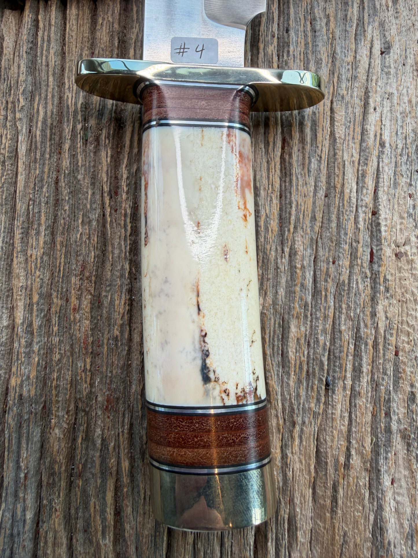 New in Paper Randall Model 12-9 Fossil Walrus Ivory and 25 style stacked Leather grip. Double Nickel Silver hilt and nickel butt cap.