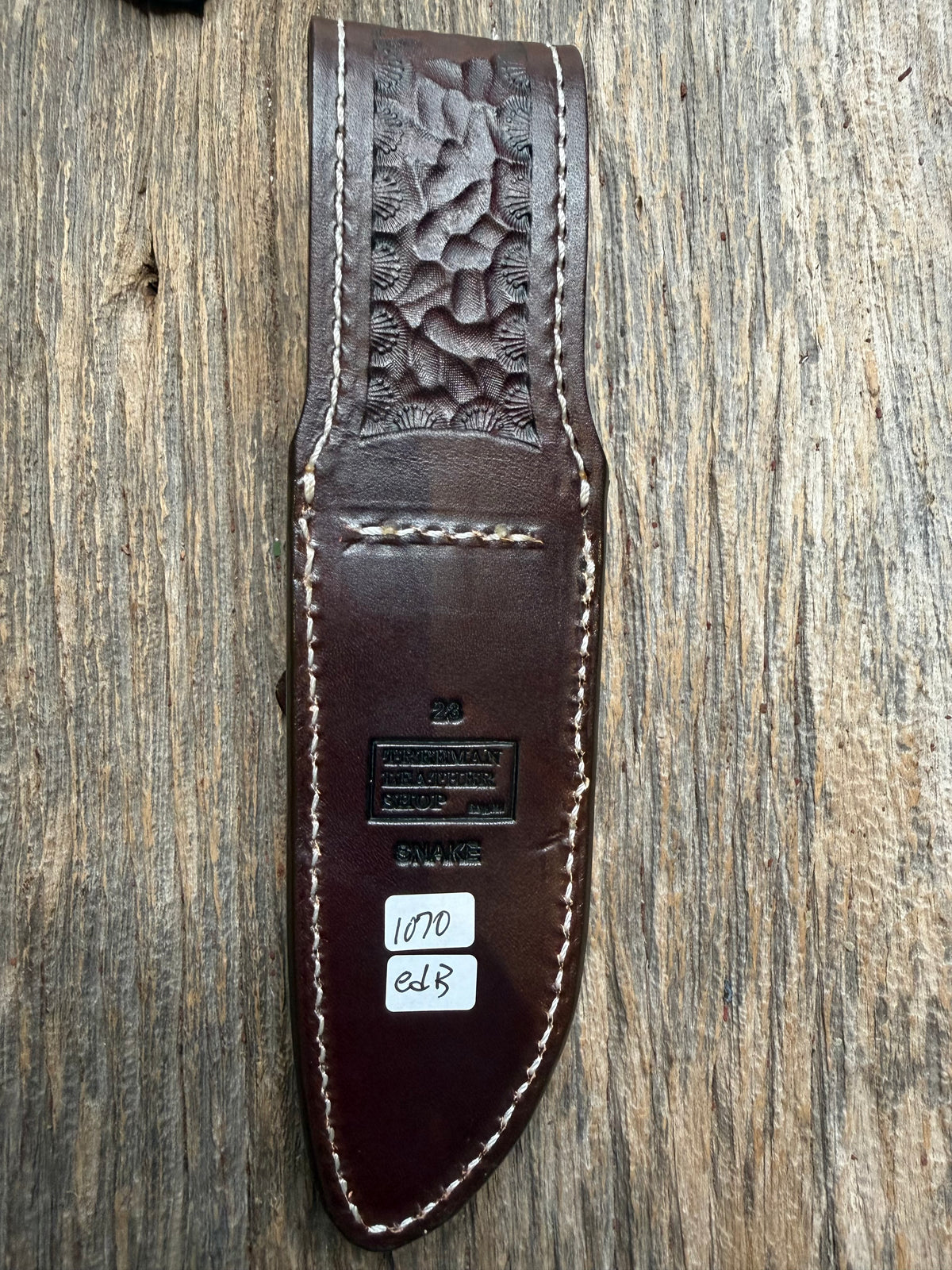 Randall Model 23 sheath with an Eastern Diamondback RattleSnake skin from Treeman Sheaths. Hand tooled belt loop, canteen snap. One the hardest skins to source.