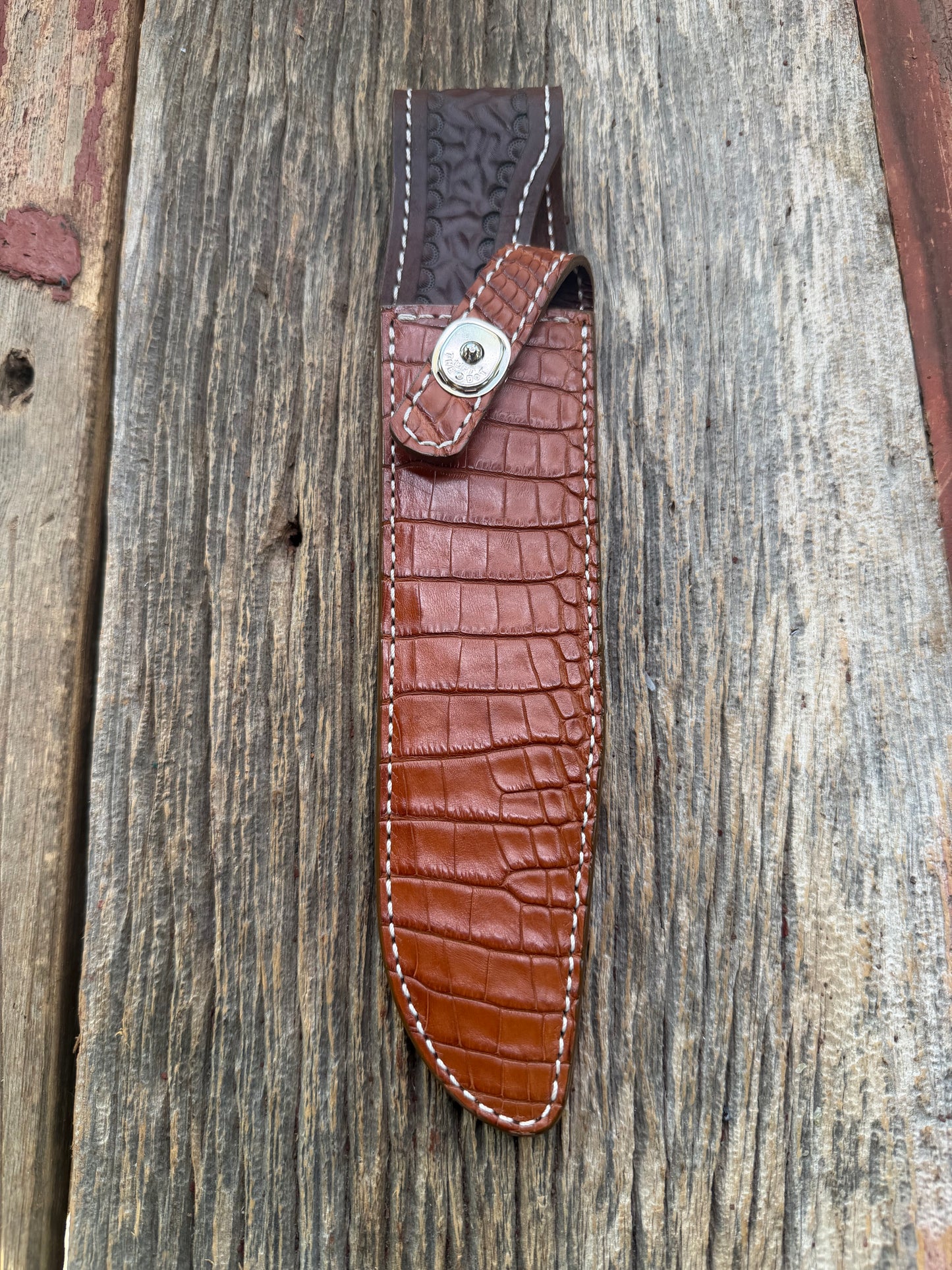 New Randall Model 1-8 Sheath in Exotic thick and textured Honey Crocodile skin on brown leather from Treeman with a silver Canteen snap. Hand tooled belt loop. Killer sheath.