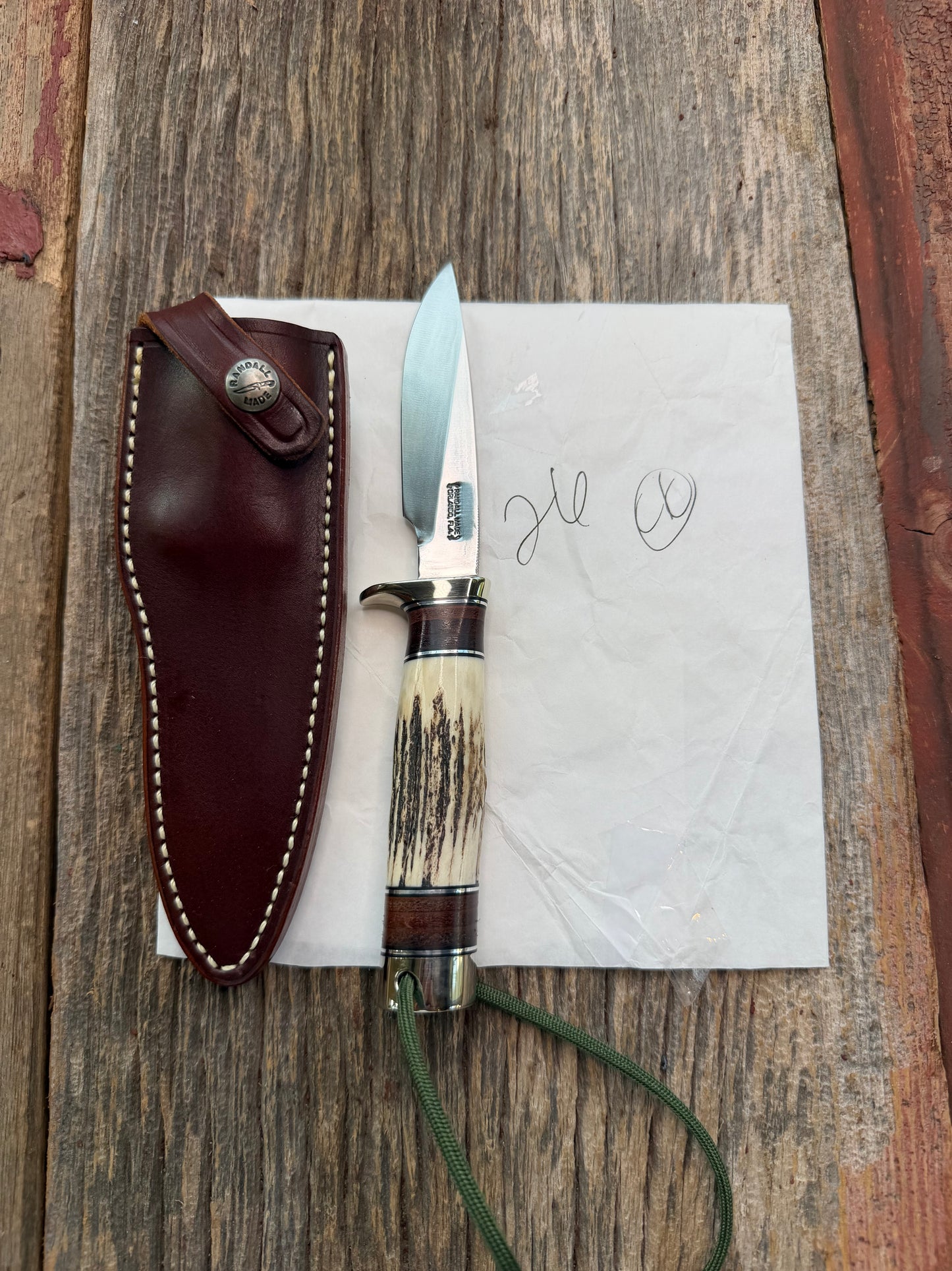 New in paper Randall Knife Model 26 Pathfinder. Stag, Black and Aluminum and leather spacers, Lanyard, NSH and buttcap.