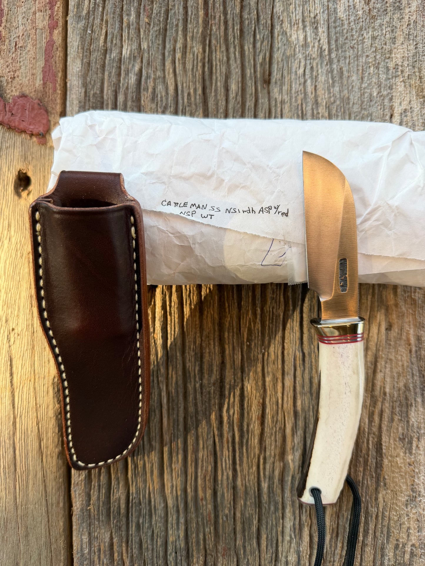 New in Paper Randall Non Catalog Model  Cattleman. Slab side Stag handle. Red and silver spacers. Stainless blade.