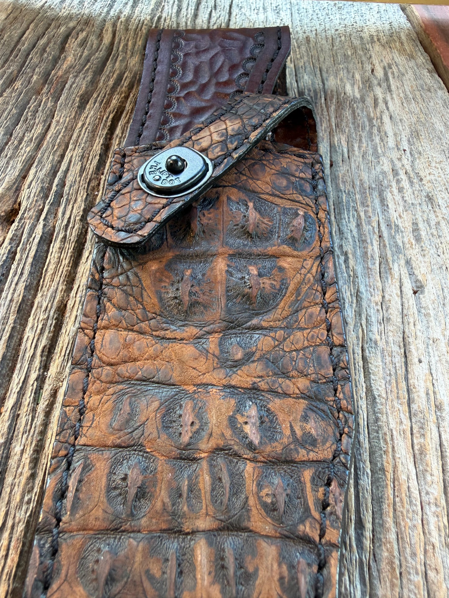 New Randall Model 12-8 Big Bear Sheath in Exotic Dark Brown Sueded Crocodile ( Skull and Hornback) from Treeman with the newest Black Canteen snap.