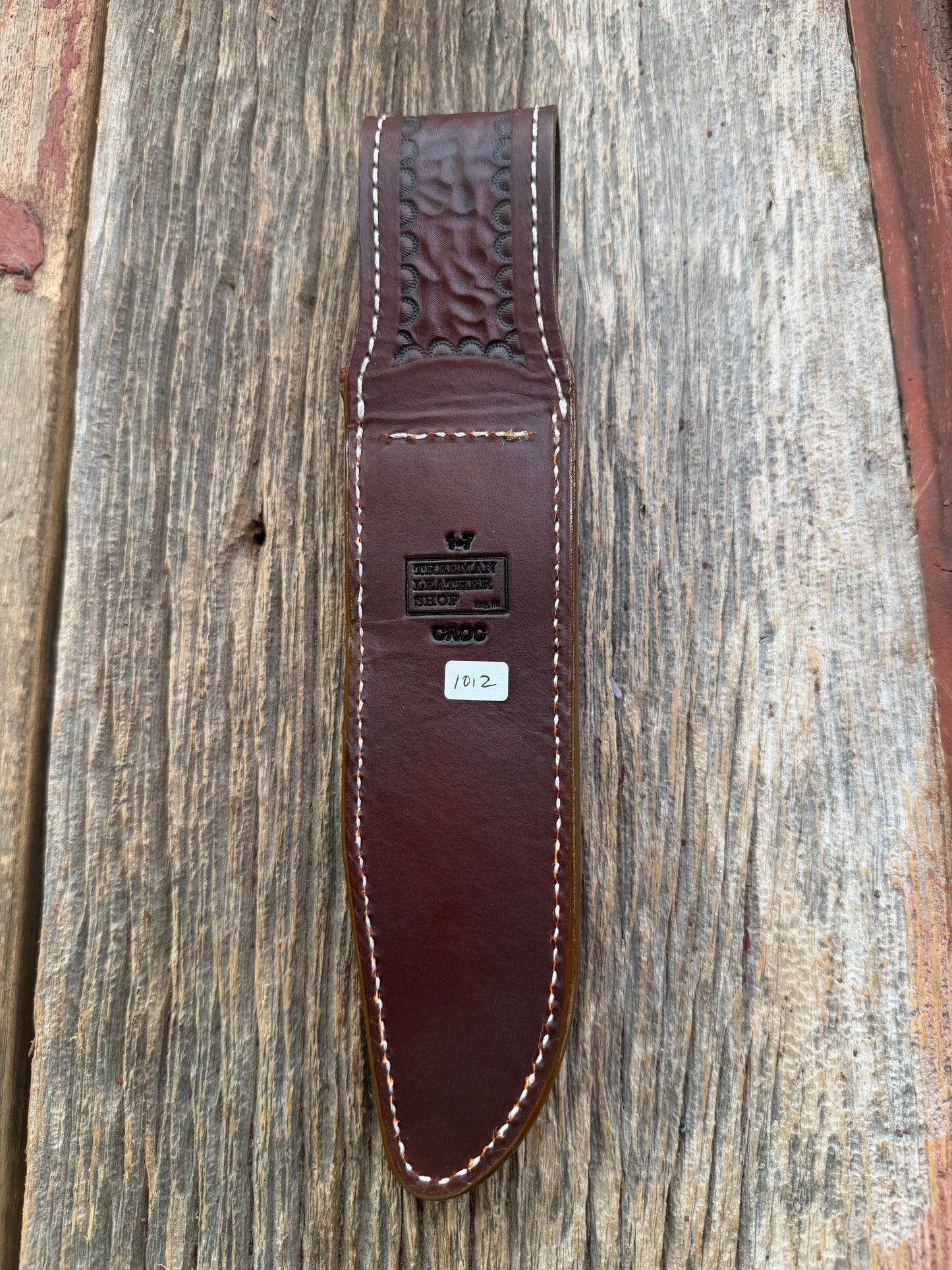 New Randall Model 1-7 Sheath in Exotic thick and textured Honey Crocodile skin on brown leather from Treeman with a silver Canteen snap. Hand tooled belt loop. Killer sheath.