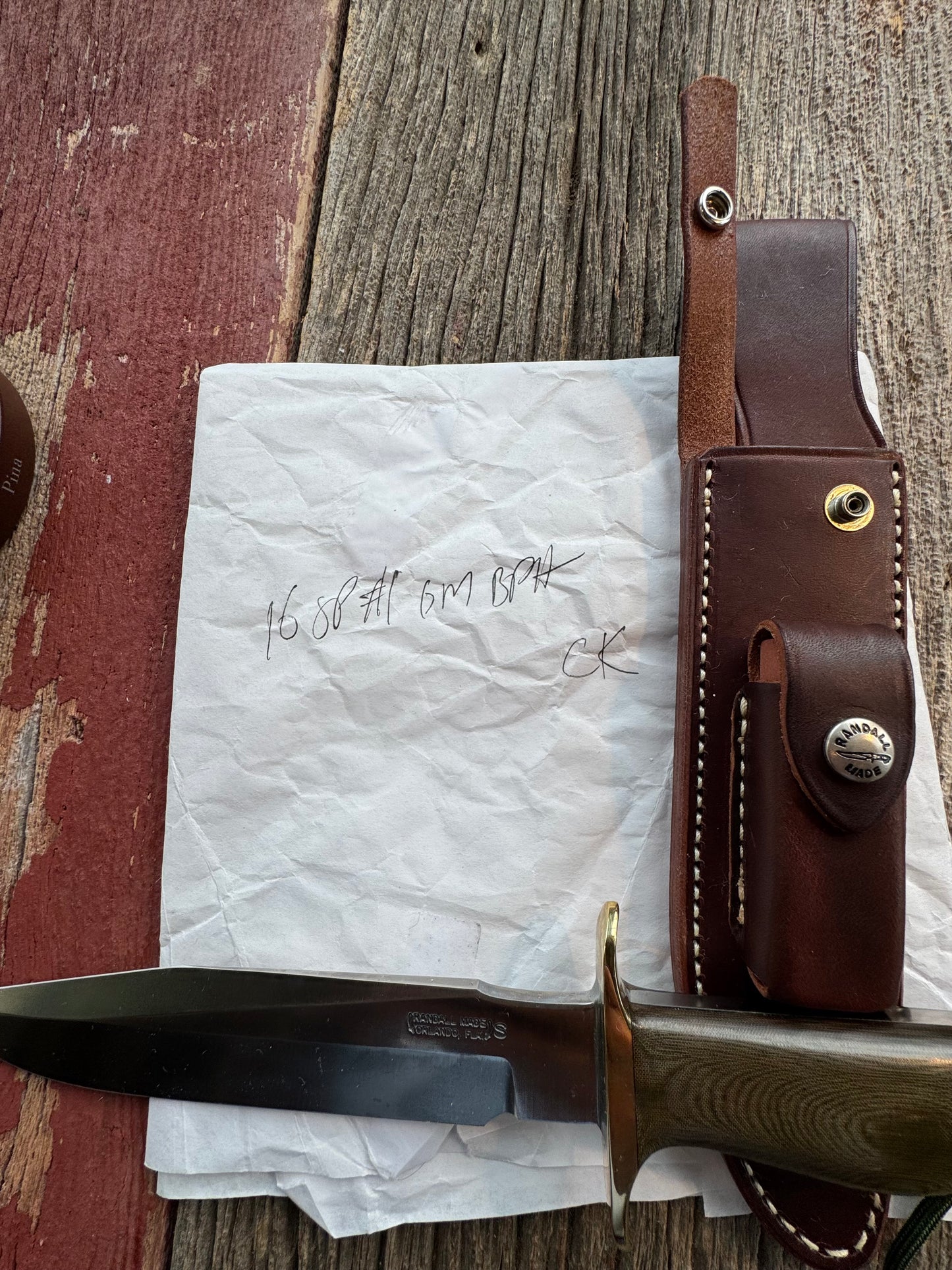 New in Paper Randall Model 16 SP#1 Special fighter with a Green Micarta handle. SS blade, Brass hilt. Lanyard. Brown leather sheath.