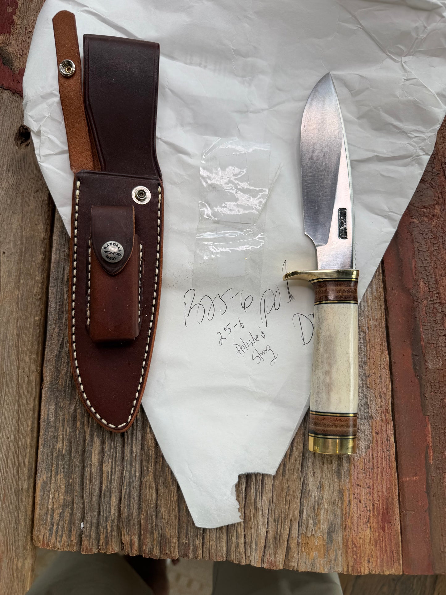 New in paper Randall Knife Model 25-6 Trapper in Polished Stag Leather Handle Stainless Blade, brass Hilt