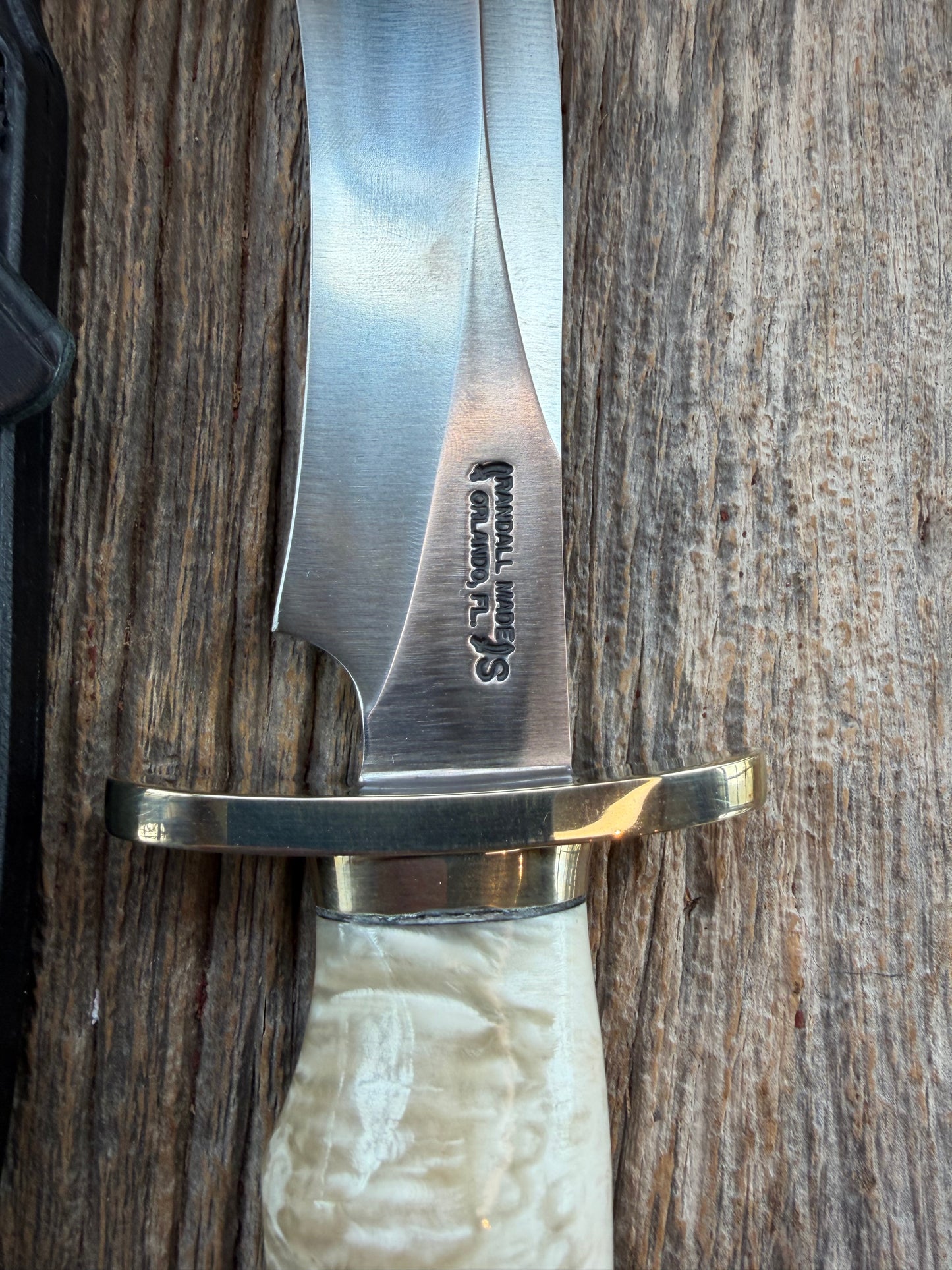 Randall Model 12-8 Small Sasquatch with a nice piece of Musk Ox. Nickel Silver collar and raw natural end.