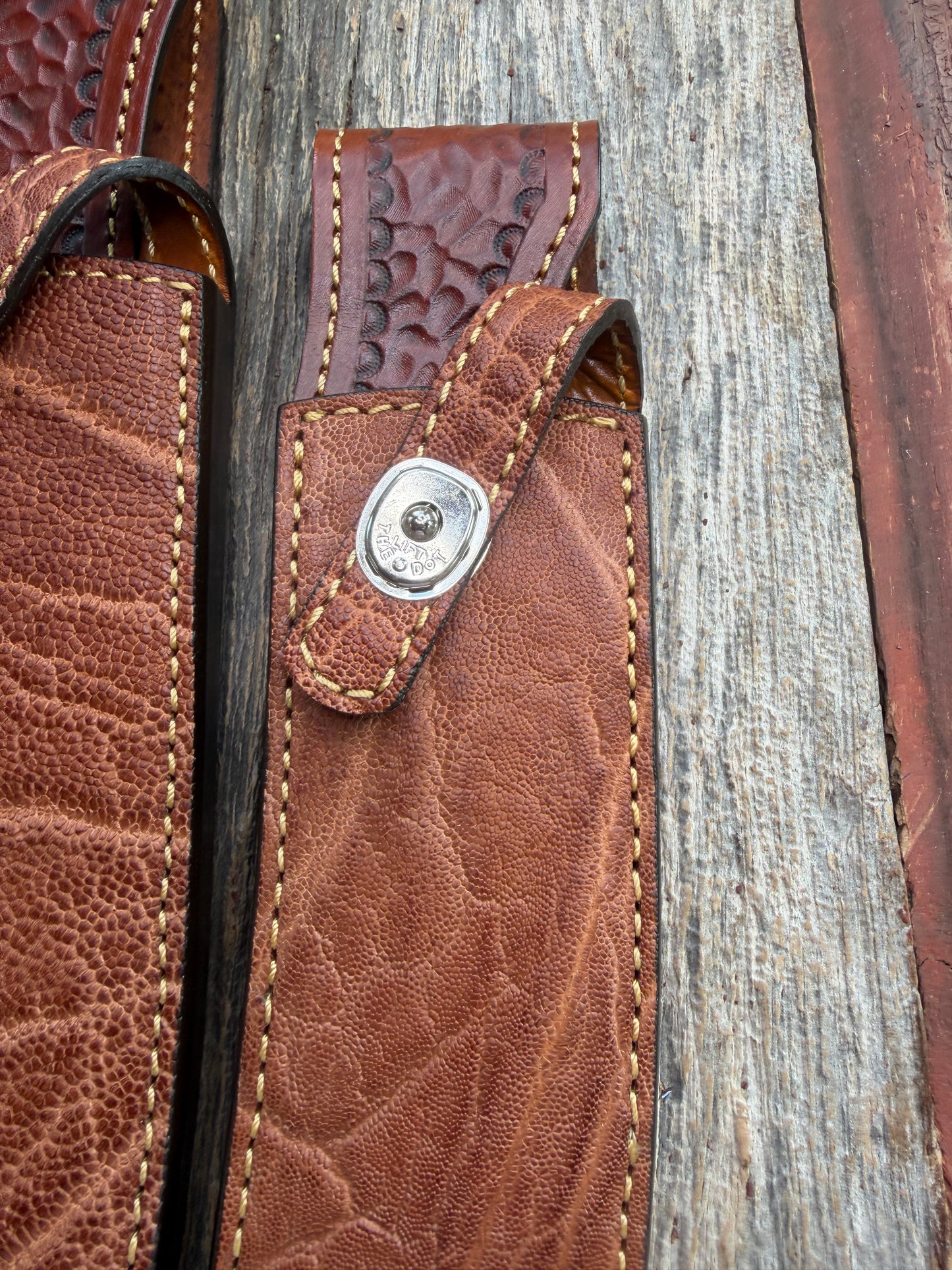 New Randall Model 12-11 Large Sasquatch and 12-8 Small Sasquatch Sheaths in Exotic thick and textured Rust colored Elephant hide on brown leather from Treeman with silver Canteen snaps. Hand tooled belt loop. Killer sheath. Selling as a pair…