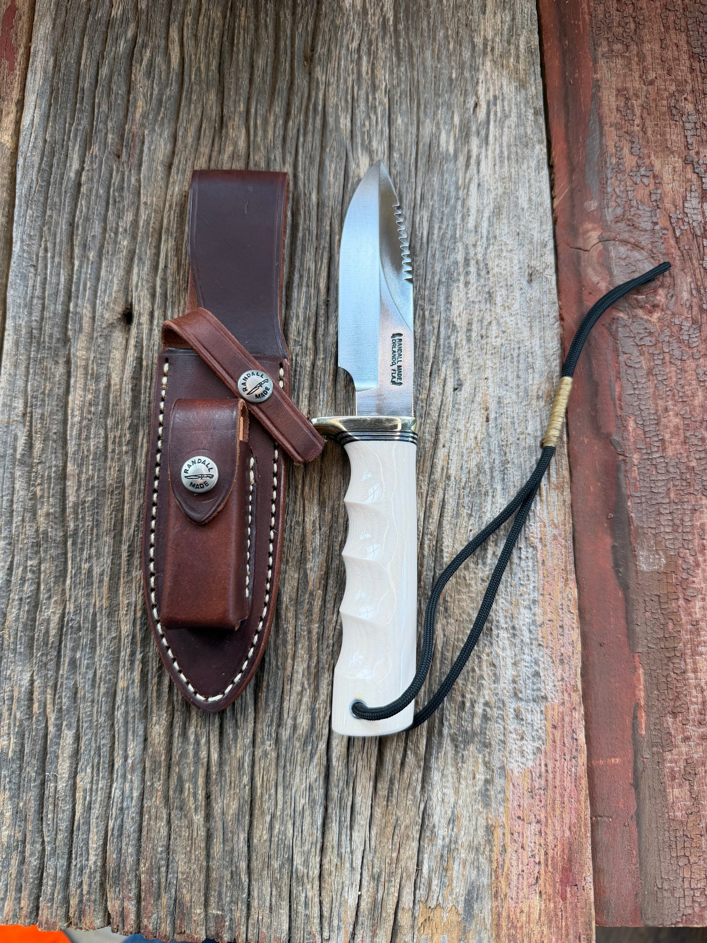 Randall Model Combat Companion with a nice piece of customer supplied Warthers Resin with finger grooves. Teeth, Nickel Silver Hilt and a raw natural end.