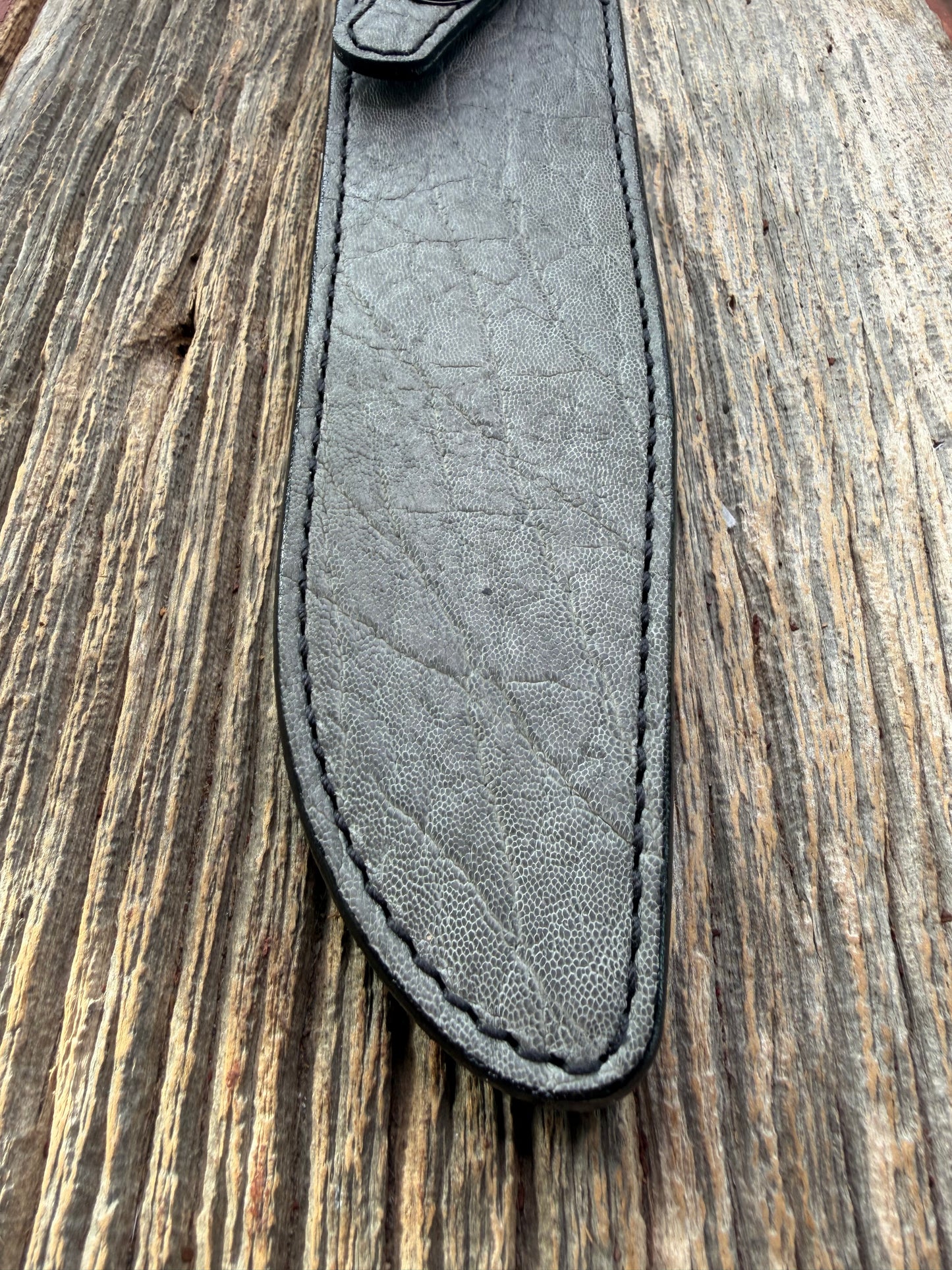 New Randall Model 1-8 Sheath in Exotic thick and textured Grey Elephant Hide on black leather from Treeman with a black Canteen snap. Hand tooled belt loop. Killer sheath.