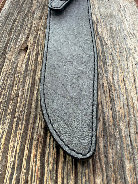 New Randall Model 1-8 Sheath in Exotic thick and textured Grey Elephant Hide on black leather from Treeman with a black Canteen snap. Hand tooled belt loop. Killer sheath.
