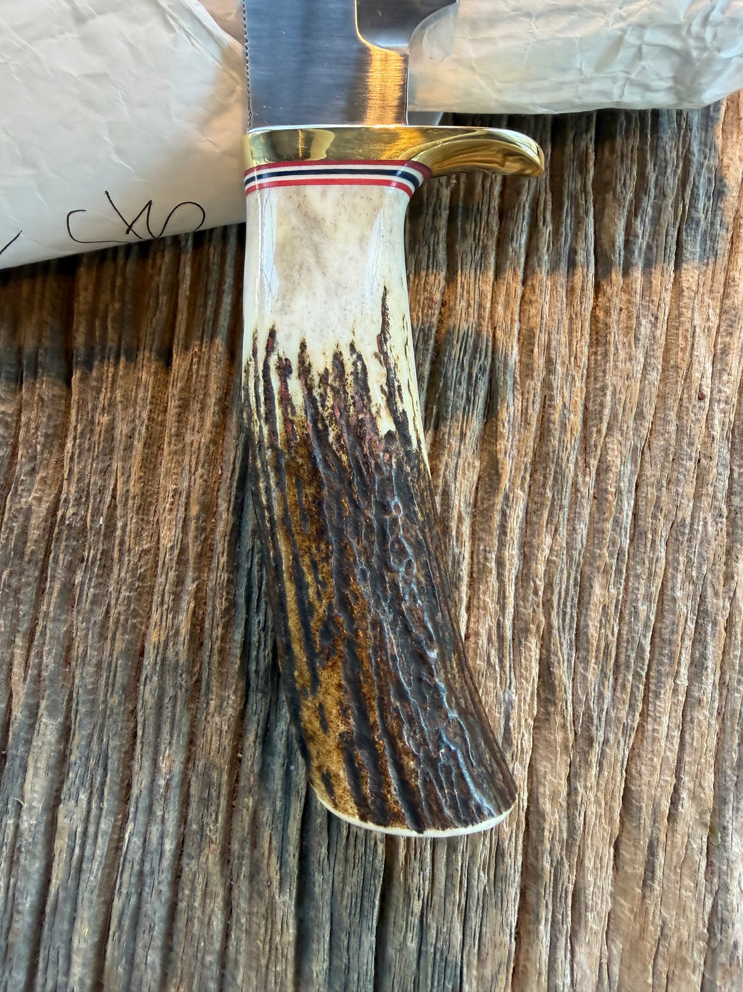 New in Paper Randall Model 19-5 Bushmaster with a Stag handle. Carbon blade, Nickel silver single hilt. Brown leather sheath.