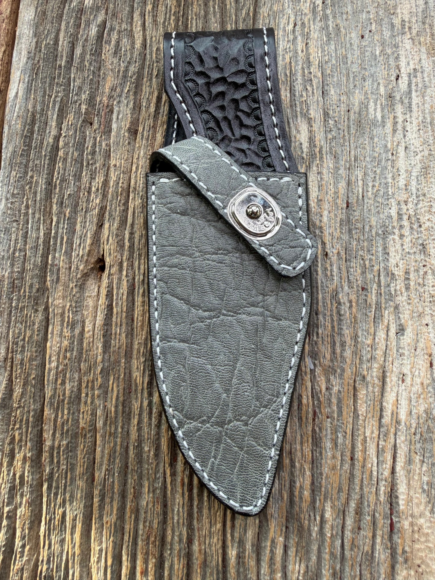 New Randall Model 19-5 Sheath in Exotic thick and textured Grey Elephant Hide on black leather from Treeman with a silver Canteen snap. Hand tooled belt loop. Killer sheath.