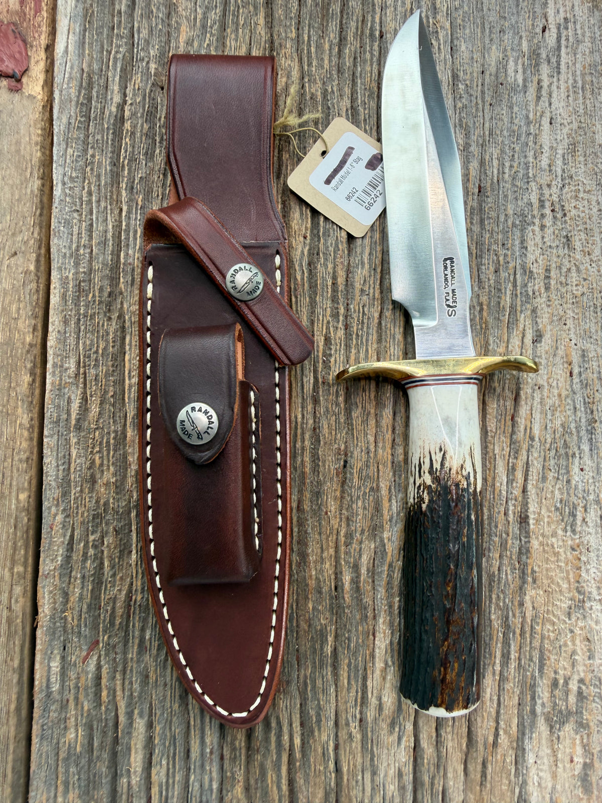 New Randall Model 1-6 with a Stag handle. Stainless steel blade, brass hilt and natural butt. Red white and Blue spacers.