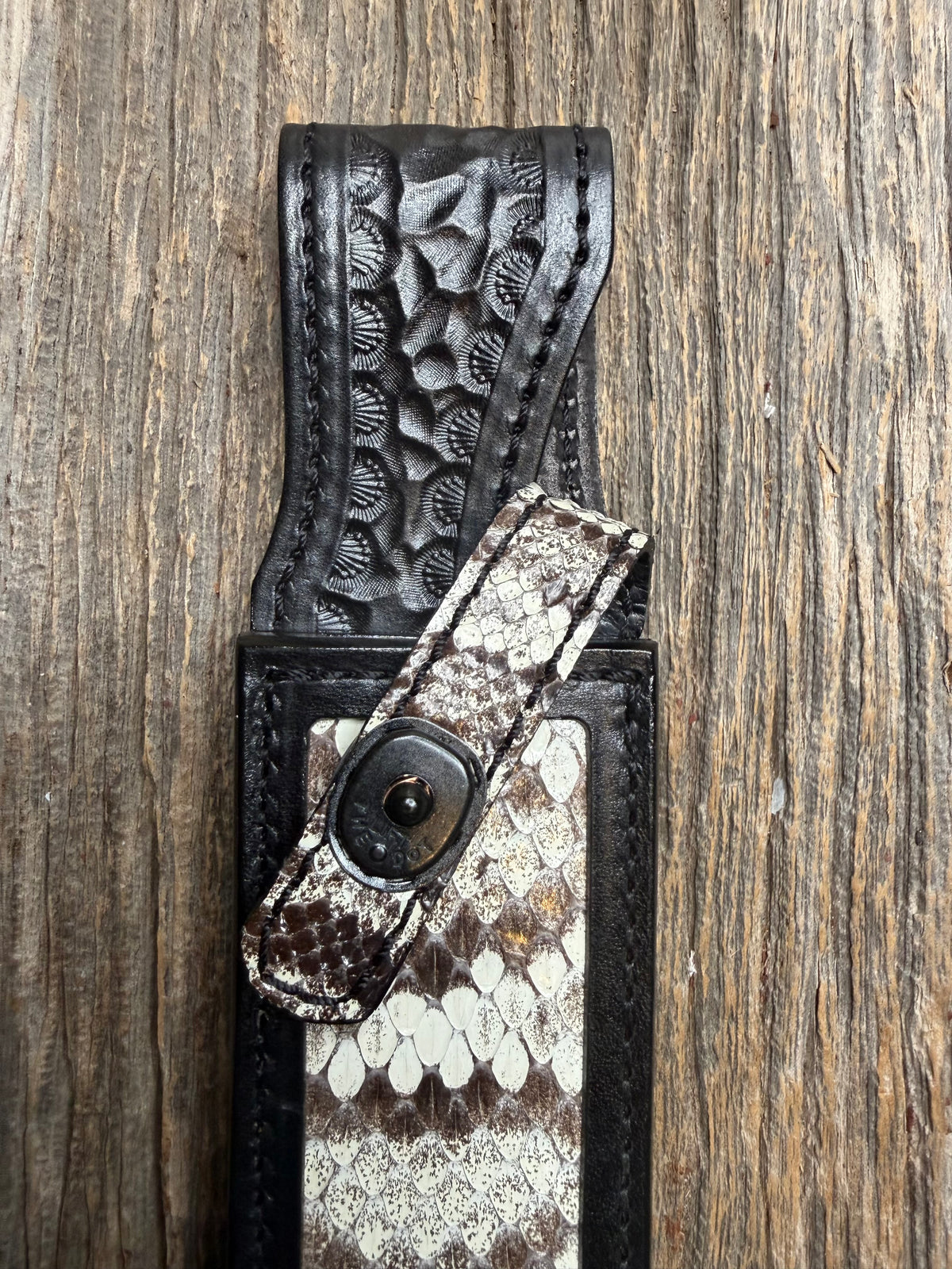 Randall Model 1-7 sheath with an Eastern Diamondback RattleSnake skin from Treeman Sheaths. Hand tooled belt loop, canteen snap. One the hardest skins to source.