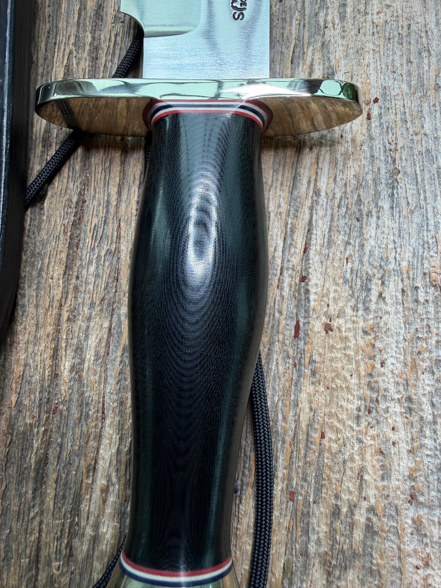 Nice Randall Model 12-9 in black Micarta handle. Red white and Blue spacers, Double Nickel Silver hilt, aluminum butt cap. Stainless blade.